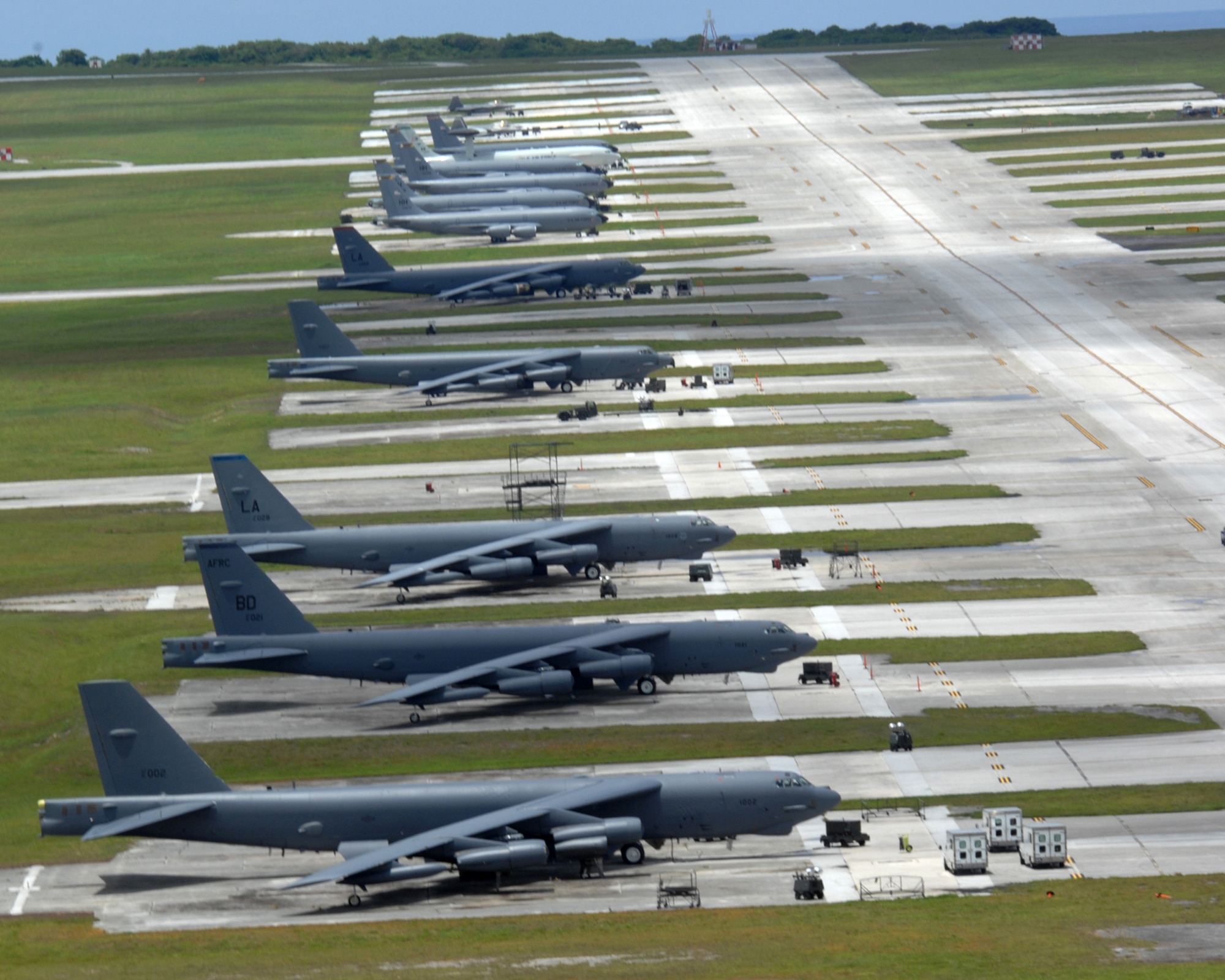 Air Force fighters, bombers, tankers and air control aircraft occupy the flightline at Andersen Air Force Base, Guam, Tuesday. The aircraft, deployed from several Air Force bases, are here to promote regional security and stability in the region.  By maintaining a continuous forward presence and conducting joint exercises, the Pacific Air Force is able to foster improved relations and interoperability with its regional friends and allies. (U.S. Air Force photo by Airman 1St Class Cory Todd)