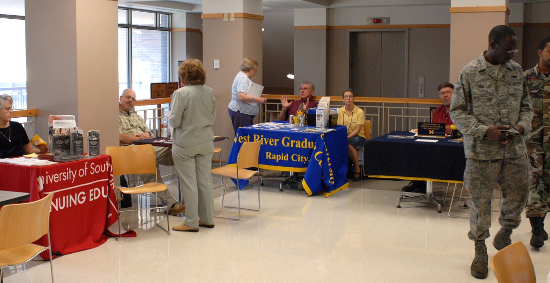 Members of the Base Education Office coordinated the 28th Force Support Squadron Education Fair, July 30, bringing nine colleges and agencies on base to provide Airmen and their families with information on ways to achieve higher education. In addition, those in attendance were treated to a free lunch and entered in a drawing for door prizes, courtesy of the Base Education Office. (U.S. Air Force photo/Staff Sgt. Joshua Stevens)