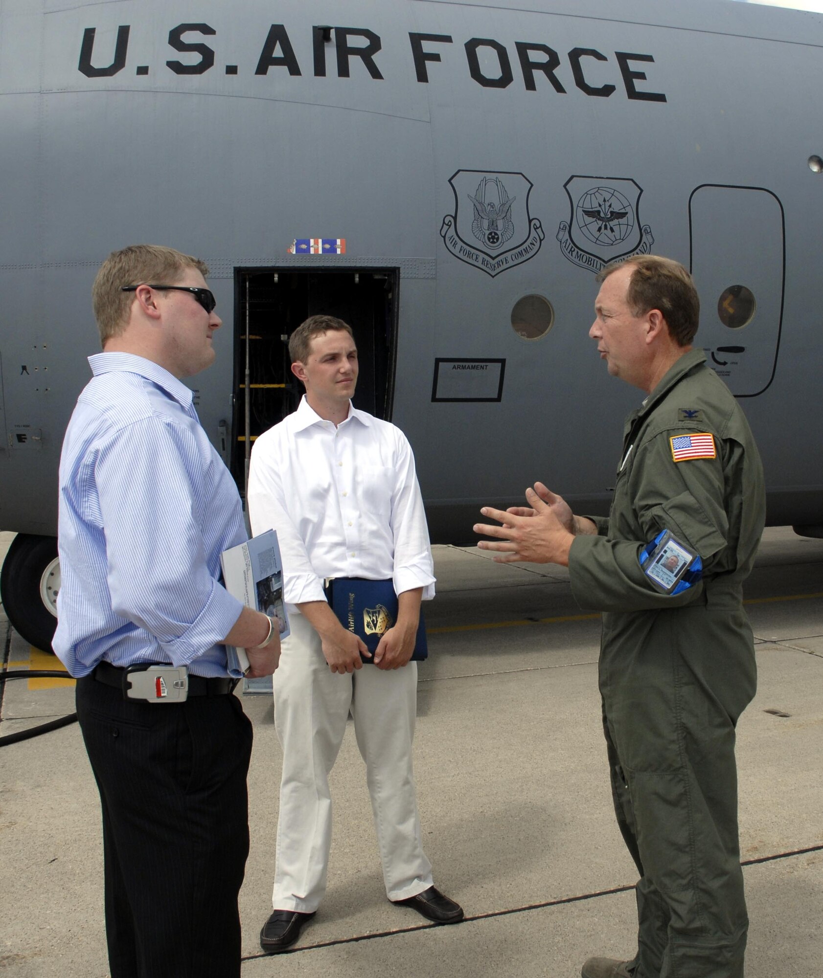 Col. Al Swartzmiller, 934th Operations Group commander, explains the mission of the C-130 aircraft within the 934th Airlift Wing and Air Force Reserve to Congressional Assistants Andy Davis (left) and David Hotz.  The two are part of Senator Norm Coleman?s staff and function as military legislative assistants to keep the Senator informed about military issues in his home state of Minnesota. (Air Force Photo/Master Sgt. Paul Zadach)
