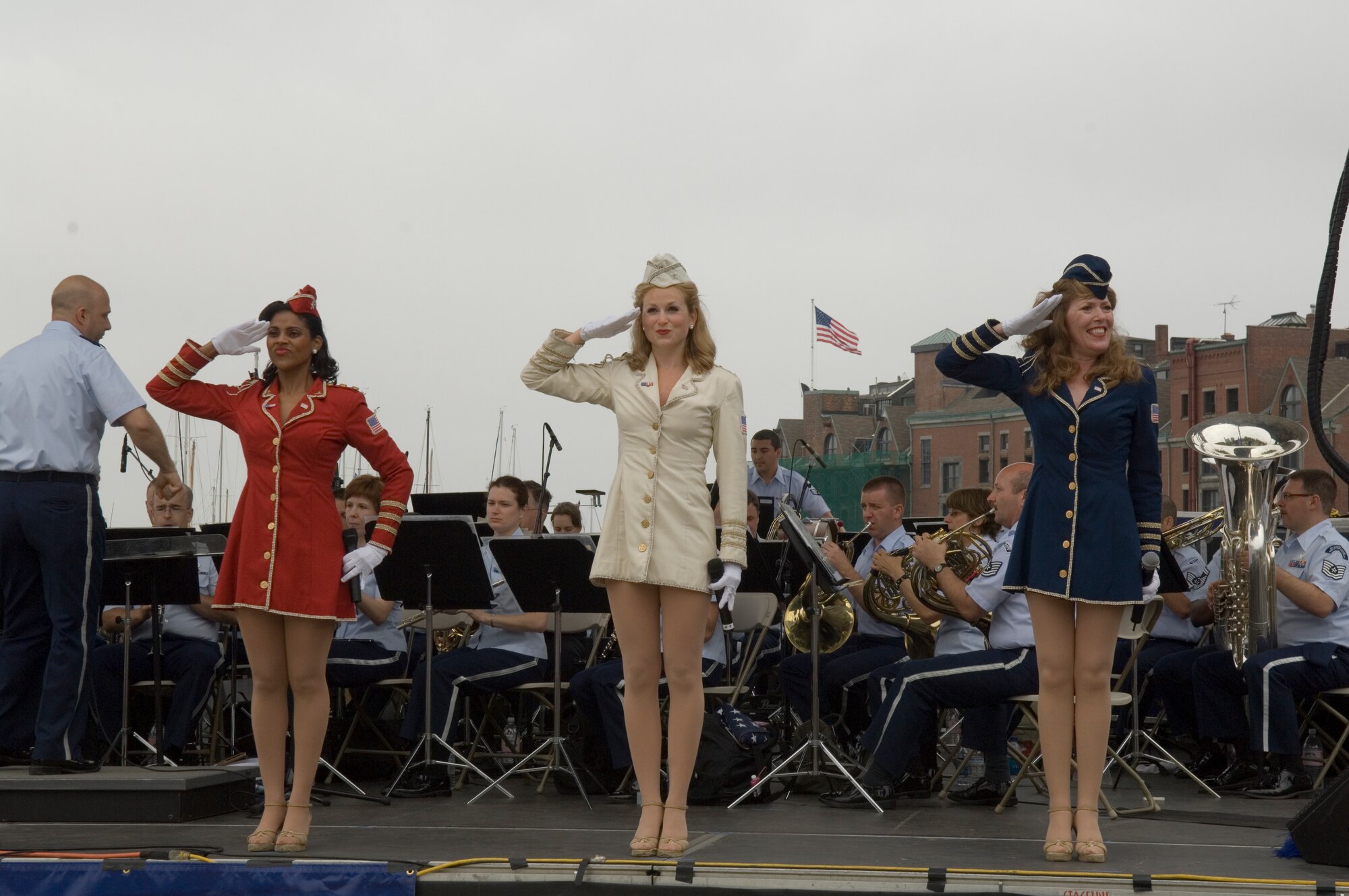 The American Belles salute the veterans in the audience during a patriotic medley at Boston's Christopher Columbus Park. (photo by Roderick Berry)