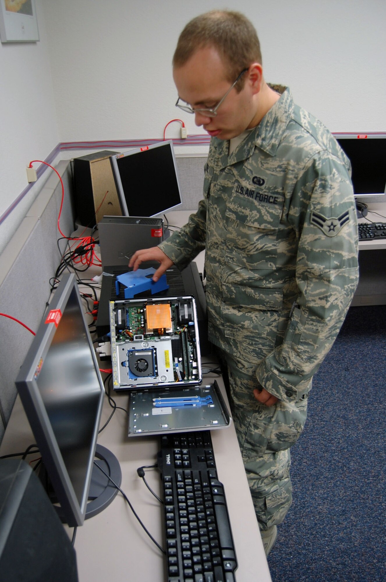 LAUGHLIN AIR FORCE BASE, Texas – Airman 1st Class Thai Neel, 47th Installation Support Squadron (Provisional), displays a piece of the new Thin Client Solution, computer system, at the 434th Fighter Training Squadron here recently. (U.S. Air Force photo by Airman 1st Class Sara Csurilla)