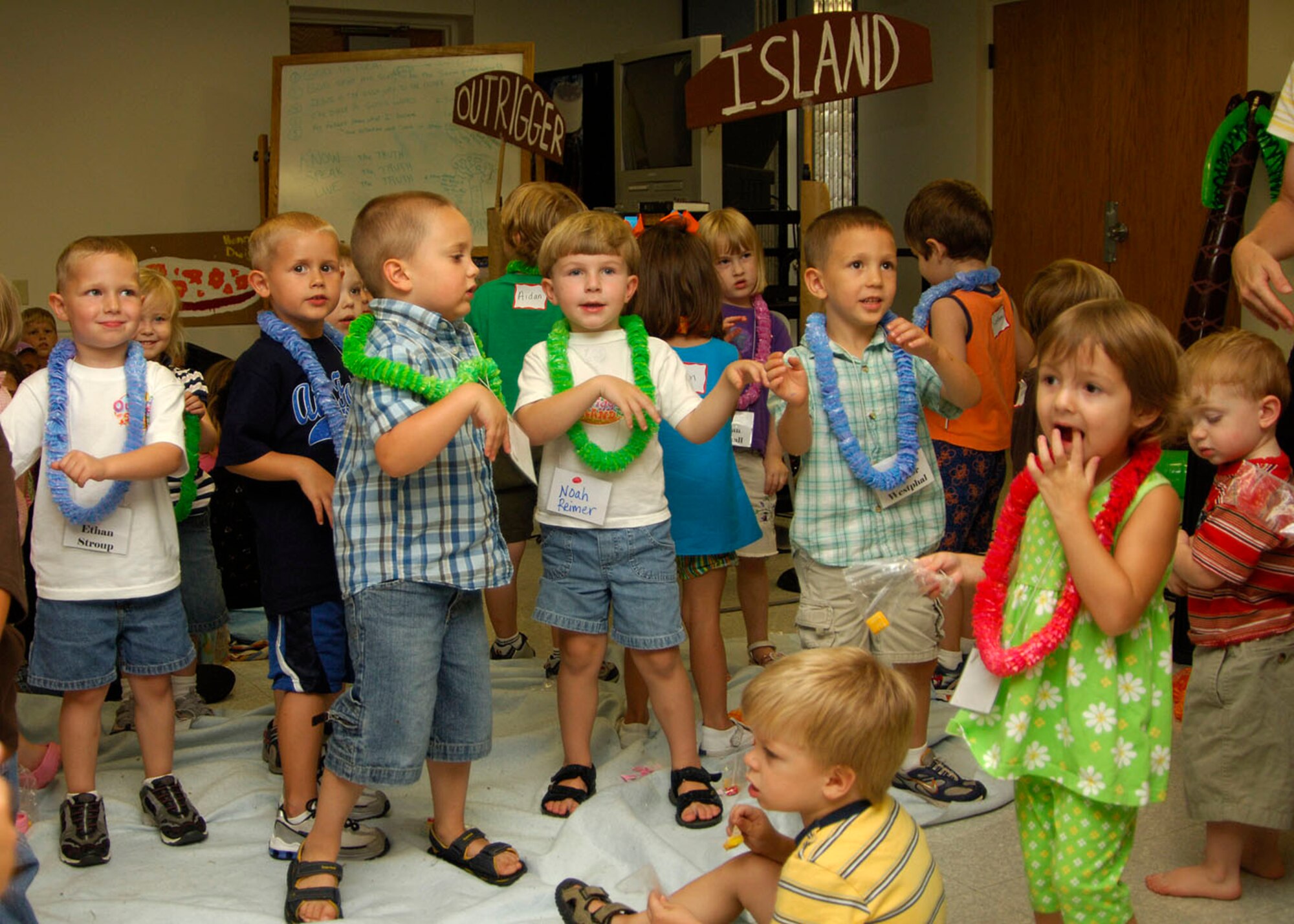 SCOTT AIR FORCE BASE, Ill. -- JTF Scott’s children show off their newly learned dance moves during a performance for their parents at the end of a Vacation Bible School Friday. The VBS, called Outrigger Island, was hosted by Chapel 1 and taught kids about the Bible through fun and games. The kids learned motions to five different songs during this five-day event. 
(US Air Force photo/Airman 1st Class Wesley Farnsworth)
