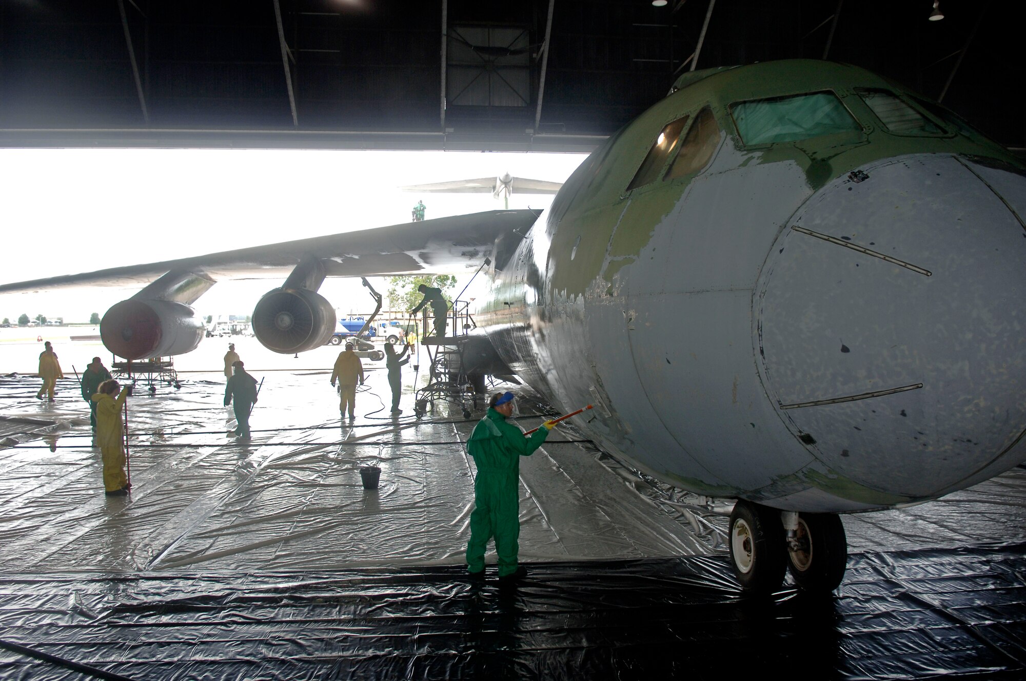 SCOTT AIR FORCE BASE, Ill. -- Members from the 126th Air Refueling Wing, 932nd Airlift Wing and 375th Airlift Wing, wash a C-141 Starlifter in Hangar One.  The C-141 will be one of five aircraft on display at the future Scott Field Heritage Airpark.  The airpark will be located just outside the Shiloh Gate, the main entrance to the base.  The airpark is being built to portray the history of Scott AFB, Air Mobility Command and the airlift, air refueling and aeromedical missions.
(U.S. Air Force photo/Tech. Sgt. Tony R. Tolley)
