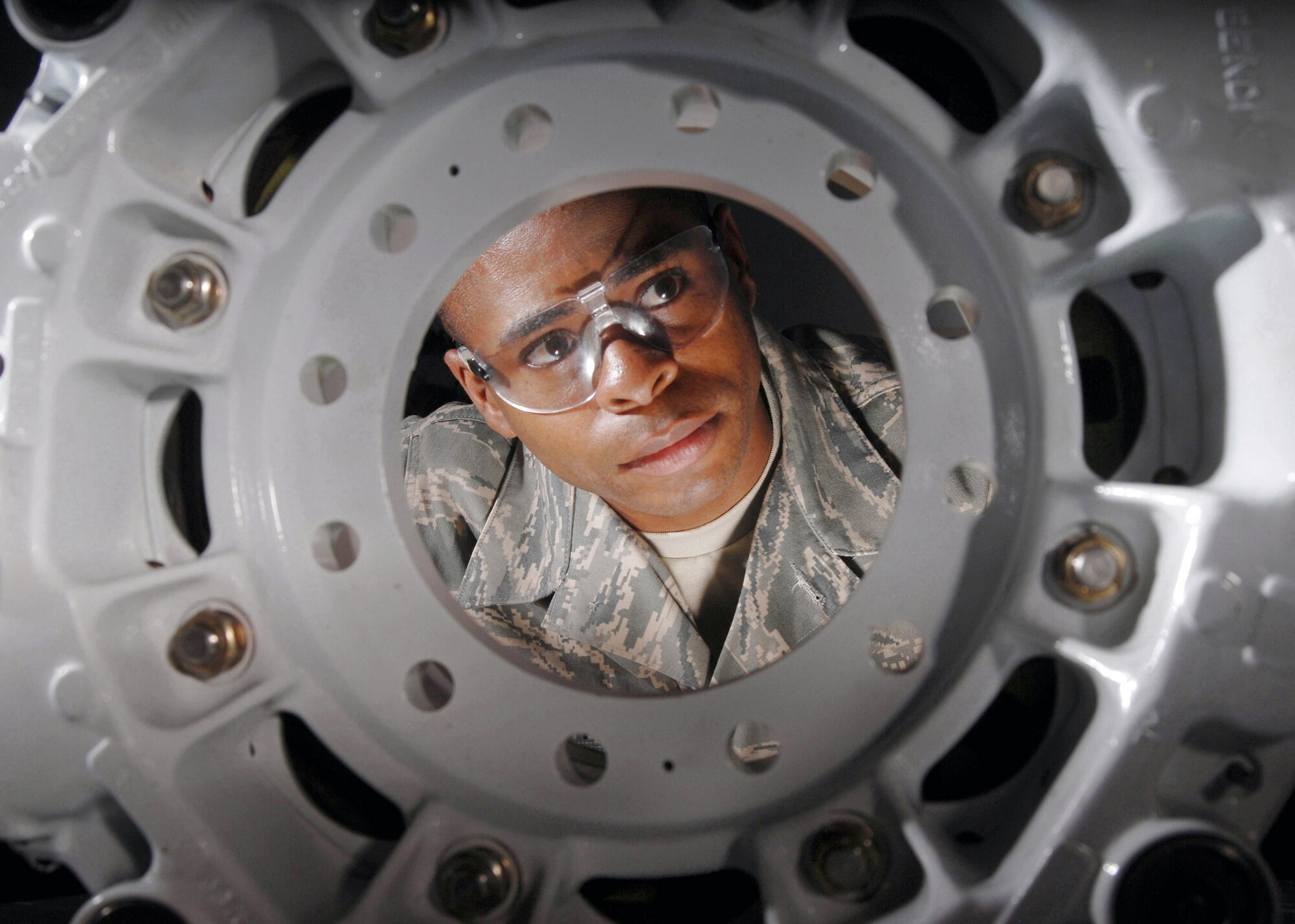 Tech. Sgt. Alan L. Scott visually inspects a KC-135 Stratotanker refueling aircraft brake assembly July 30 at March Air Reserve Base, Calif.  March ARB, located in Southern California, is home to the largest air mobility wing in the Air Force Reserve Command. It is also home to units from the Army Reserve, Navy Reserve, Marine Corps Reserve and Air National Guard.  Sergeant Scott is a pneudraulics technician from the 452nd Maintenance Squadron. (U.S. Air Force photo/Val Gempis) 