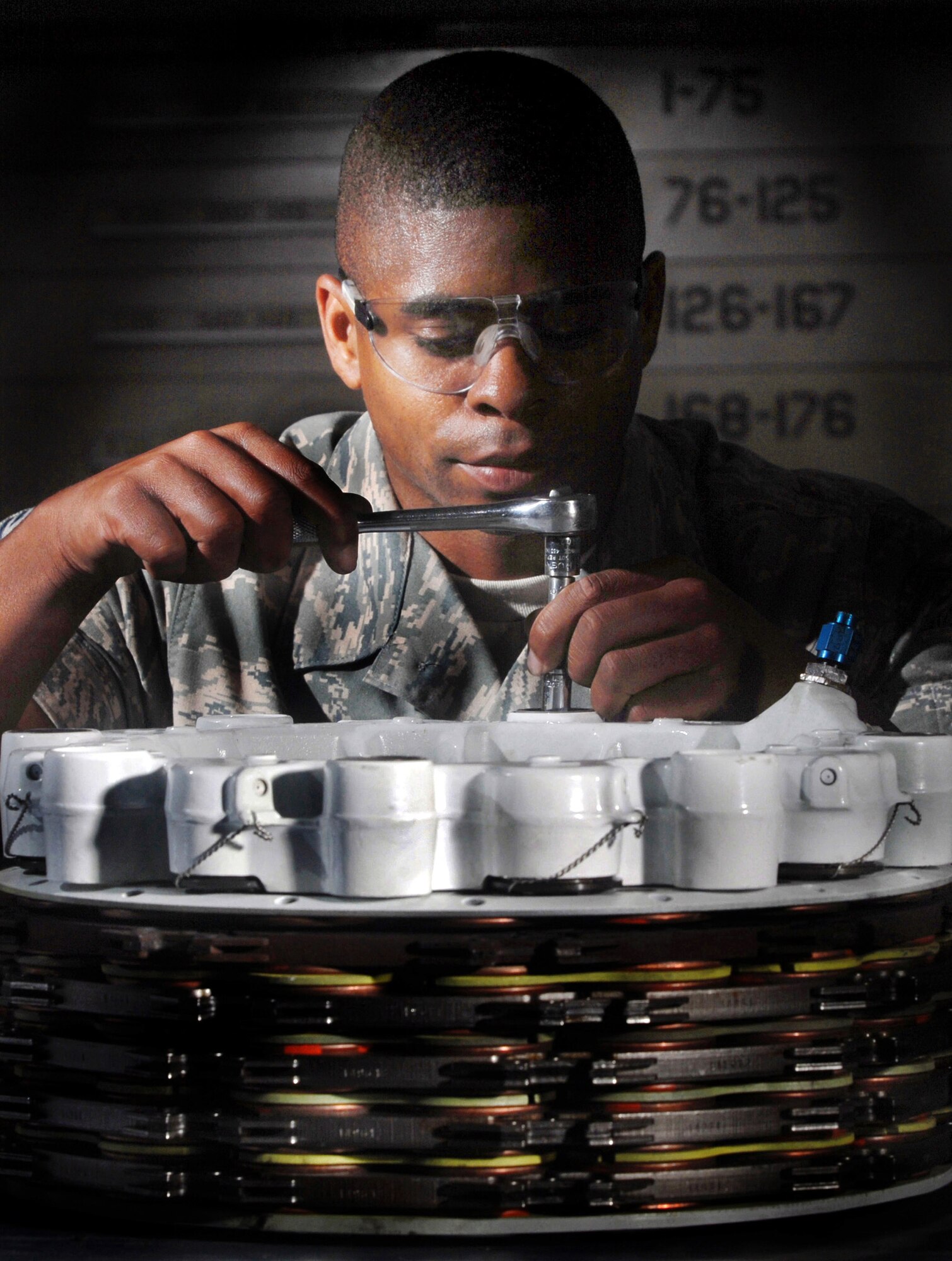Tech. Sgt. Alan L. Scott tightens a bolt on KC-135 Stratotanker brake assembly July 30 at March Air Reserve Base, Calif.  March ARB, located in Southern California, is home to the largest air mobility wing in the Air Force Reserve Command. It is also home to units from the Army Reserve, Navy Reserve, Marine Corps Reserve and Air National Guard.  Sergeant Scott is a pneudraulics technician from the 452nd Maintenance Squadron. (U.S. Air Force photo/Val Gempis) 