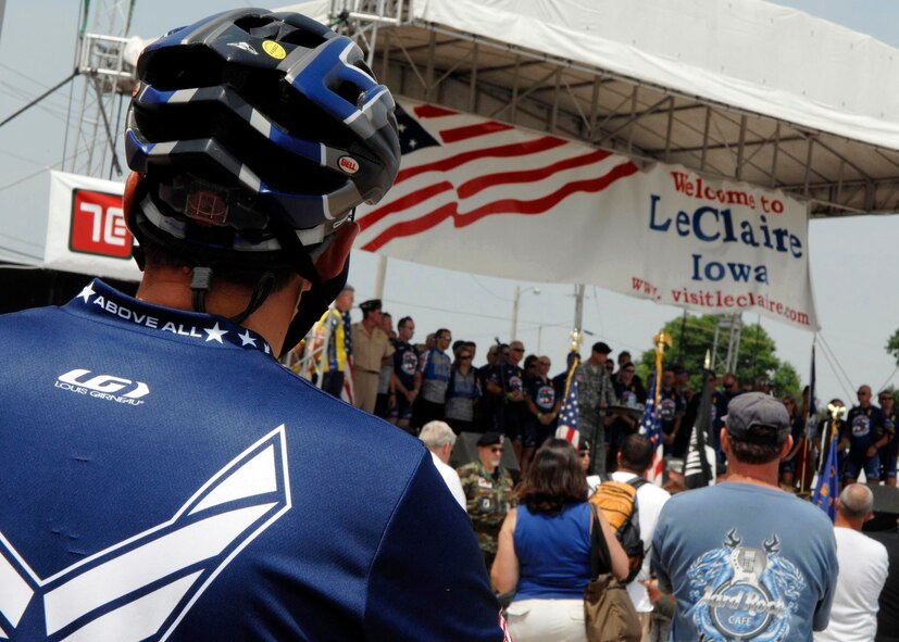 LE CLAIRE, Iowa - A crowd of cyclists watch the closing ceremony of the 36th Registers Annual Great Bike Ride Across Iowa, July 26. This is the first closing ceremony for the RAGBRAI in years, and as first time hosts of the RAGBRAI, the natives of Le Claire chose to recognize the Air Force Cycling Team's participation with a military appreciation closing ceremony.(U.S. Air Force photo by Airman 1st Class Joanna M. Kresge)