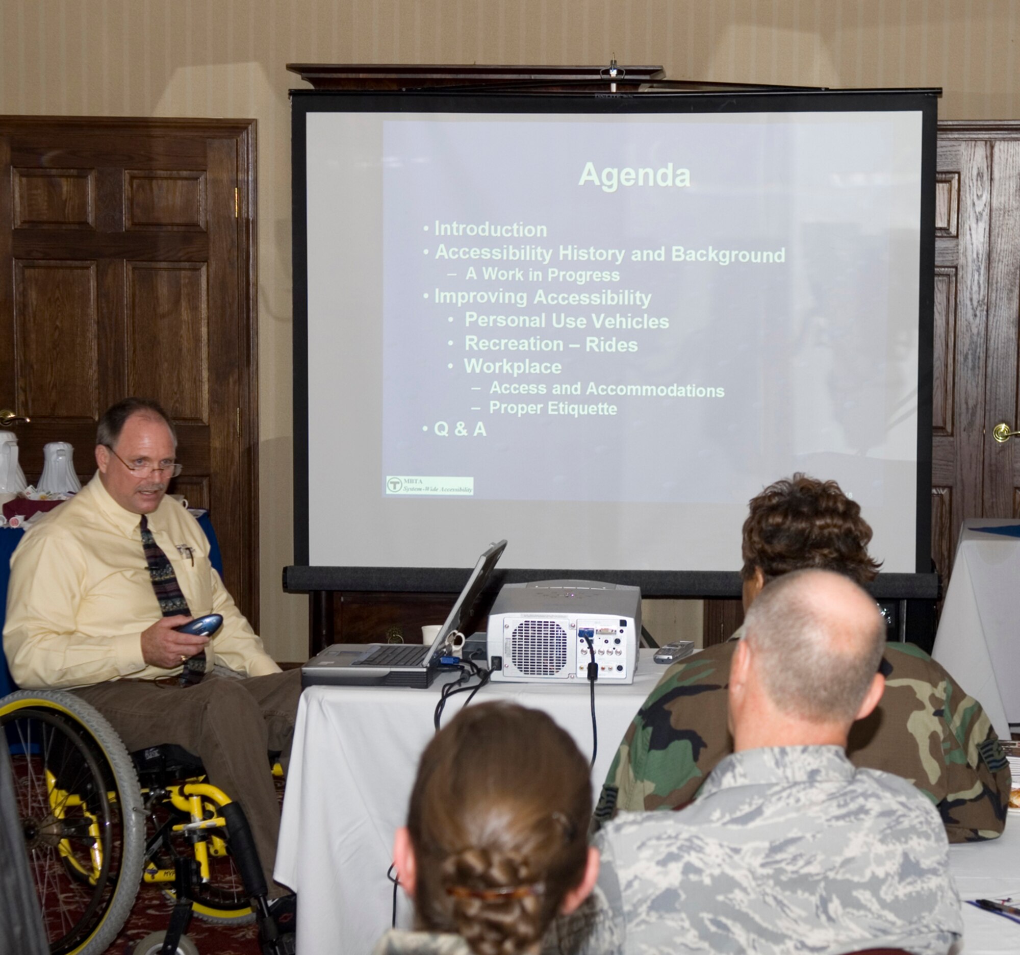 HANSCOM AFB, Mass. – Attendees to the July 29 Diversity Day breakfast at the Minuteman Club listen to guest speaker Gary Talbot, MBTA System-wide Accessibility assistant general manager. The theme of Mr. Talbot’s presentation was “Double A: Access and Accommodations. (U.S. Air Force photo by Rick Berry)