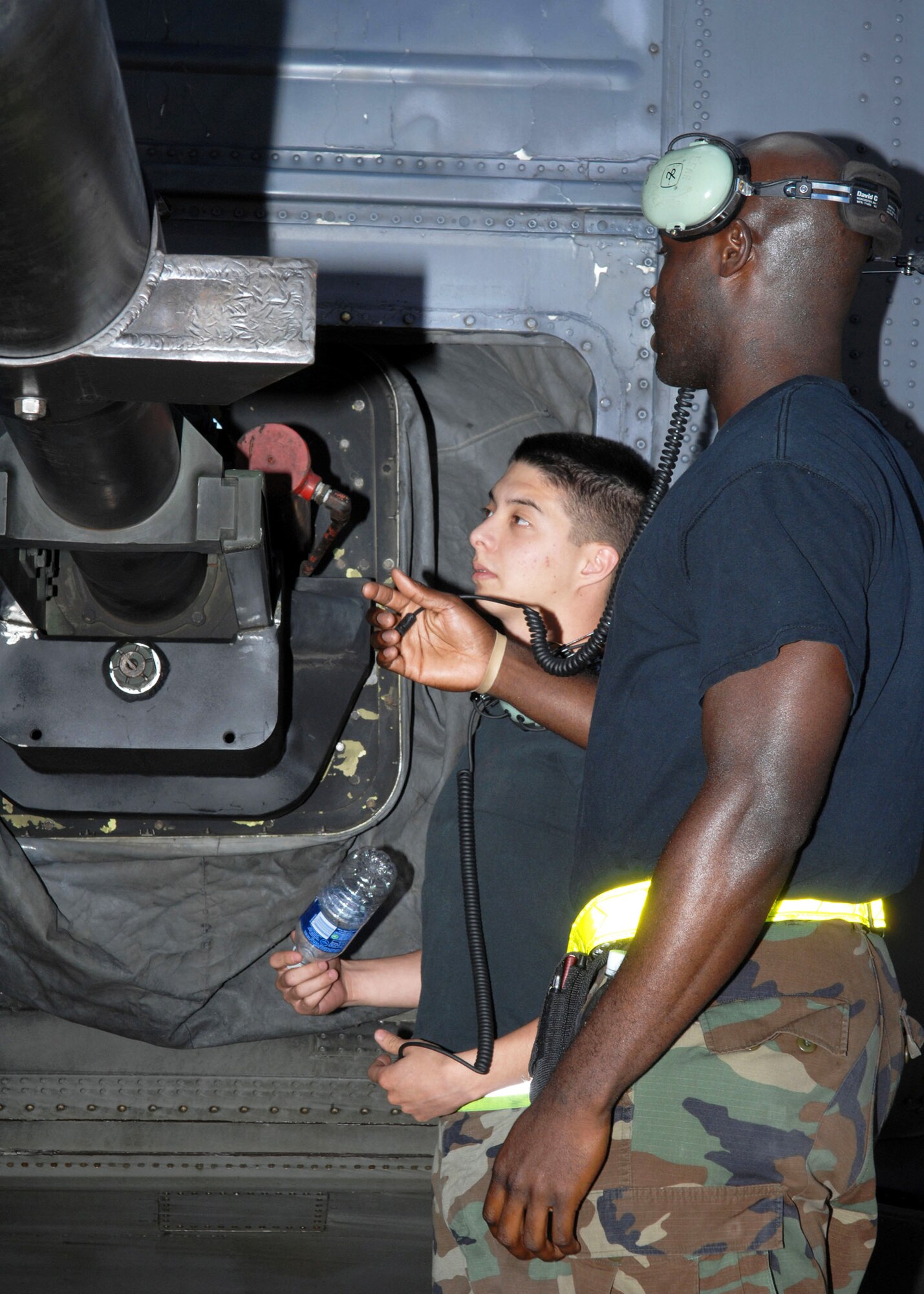 CANNON AIR FORCE BASE, N.M. -- (Left) Senior Airman Trebor Lindstamer and Staff Sgt. Robin Clements, both assigned to 1st Special Operations Aircraft Maintenance Squadron at Hurlburt Field, Fla., inspect the barrel of an AC-130H Spectre Gunship July 25. Several Airmen from Hurlburt Field came to Cannon for training and to refine local flying procedures. (U.S. Air Force photo/Airman 1st Class Danielle Martin)