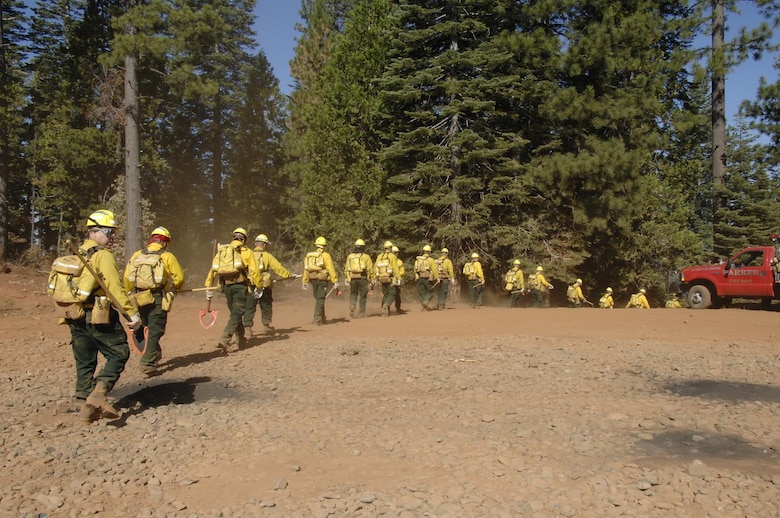 Members from the 129th Rescue Wing, 144th Fighter Wing, 146th Airlift Wing, 163rd Reconnaissance Wing, and 162nd Combat Communications Group, California Air National Guard, head out to the forest outside of Paradise City, Calif. to conduct fireline training during Operation Lightning Strike July 27.  More than 200 Airmen from across California completed their four-day firefighting training and deployed July 30 to the Telegraph Fire near Yosemite National Forest north of Fresno. (U.S. Air Force photo by Master Sgt. Dan Kacir)
