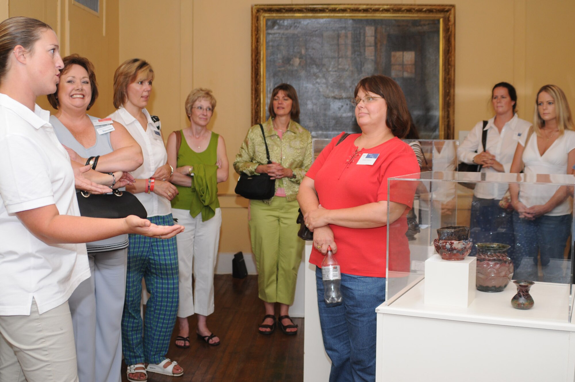 Sara Miller, left, education program coordinator for Biloxi’s Ohr-O’Keefe Museum of Art, gives a tour to Keesler spouses who are new to the Mississippi Gulf Coast, Friday.  The familiarization trip was sponsored by the Biloxi Chamber of Commerce’s military affairs committee.  The day also included a visit to Gulfport’s Lynn Meadows Discovery Center and Biloxi’s Edgewater Mall and Beauvoir, the last home of Jefferson Davis.  (U.S. Air Force photo by Kemberly Groue)