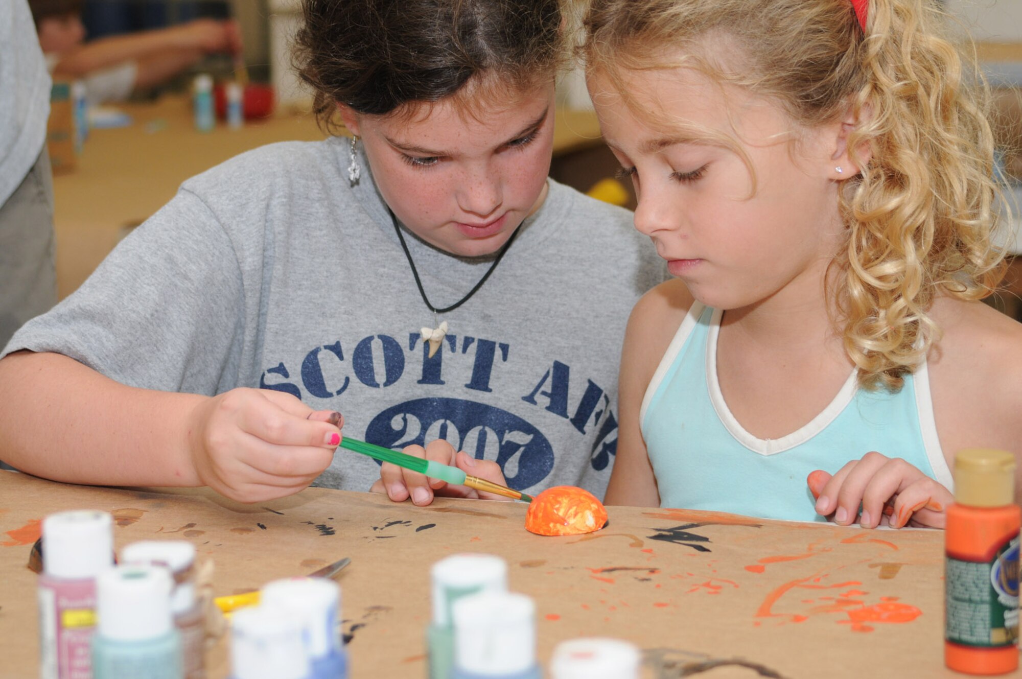 Colleen Valle, 9, and Meagan Webb, 8, work on a ceramics project during Saturday’s end-of-summer camp jamboree at the arts and crafts center.  Colleen’s parents are Col. Christopher and Mary Valle, 81st Training Wing vice commander.  Meagan’s parents are Capt. Kevin and Tricia Webb, 81st Surgical Operations Squadron.  (U.S. Air Force photo by Kemberly Groue)

