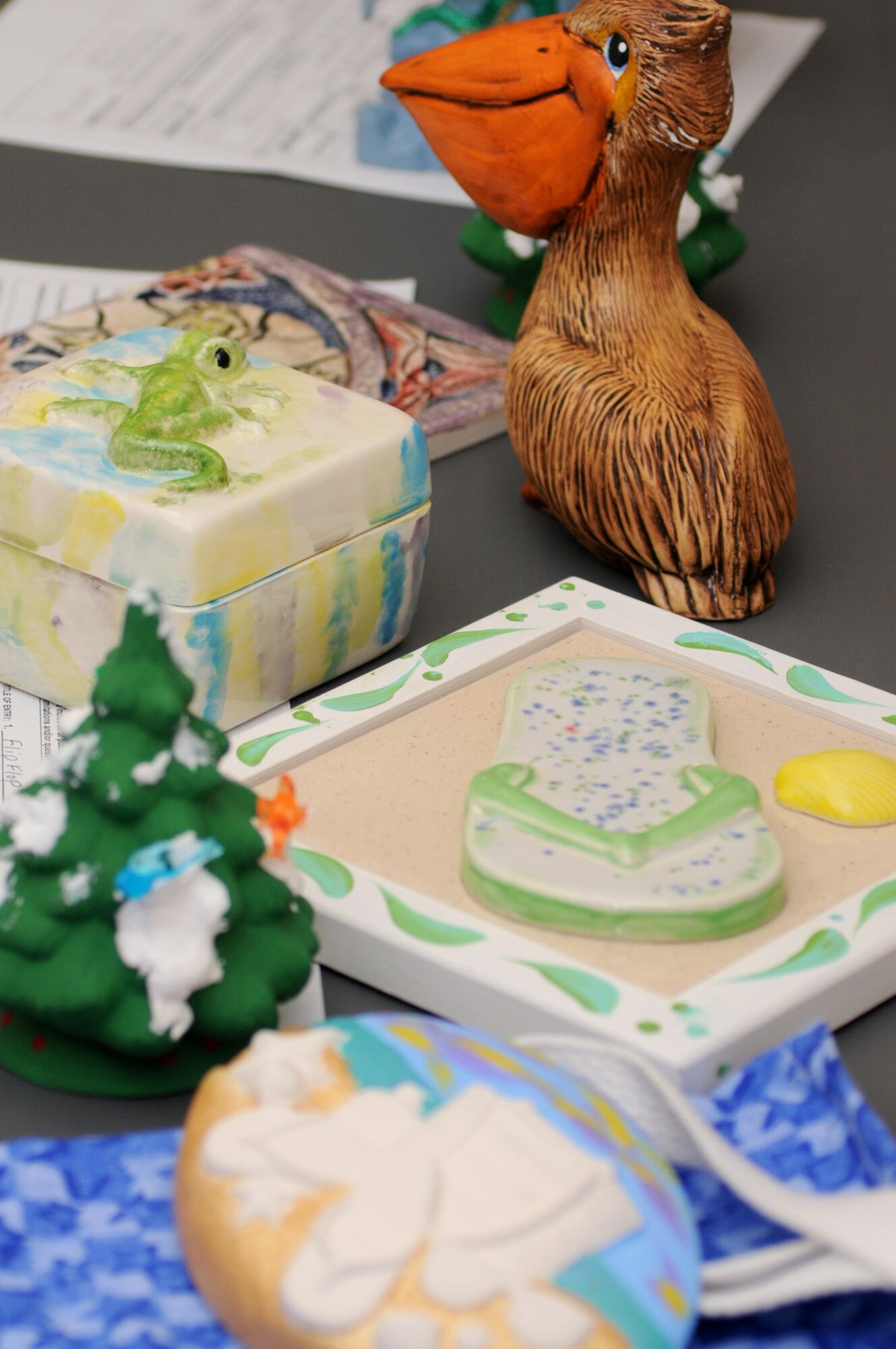 Some of the youth projects created during the arts and crafts center’s summer camp are displayed.  (U.S. Air Force photo by Kemberly Groue)