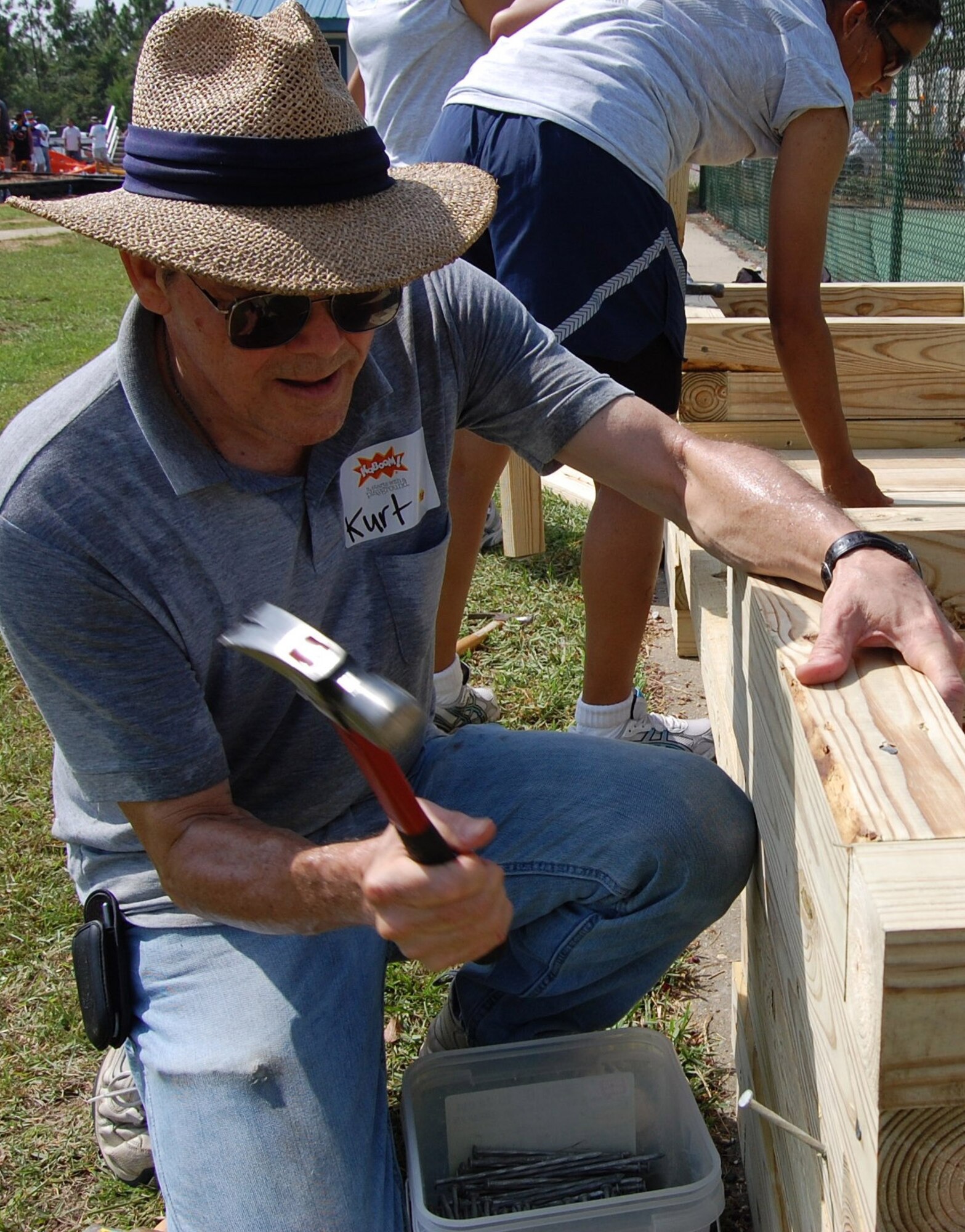 Kurt Hays work on KABOOM playground construction Saturday near the Wool-market Community Center.  More than 200 Keesler volunteers from the 81st Medical Support Squadron and 334th and 335th Training Squadrons joined other community members of the local community in the project.  Mr. Hays is from the 81st MDSS,  (U.S. Air Force photo by Steve Pivnick)