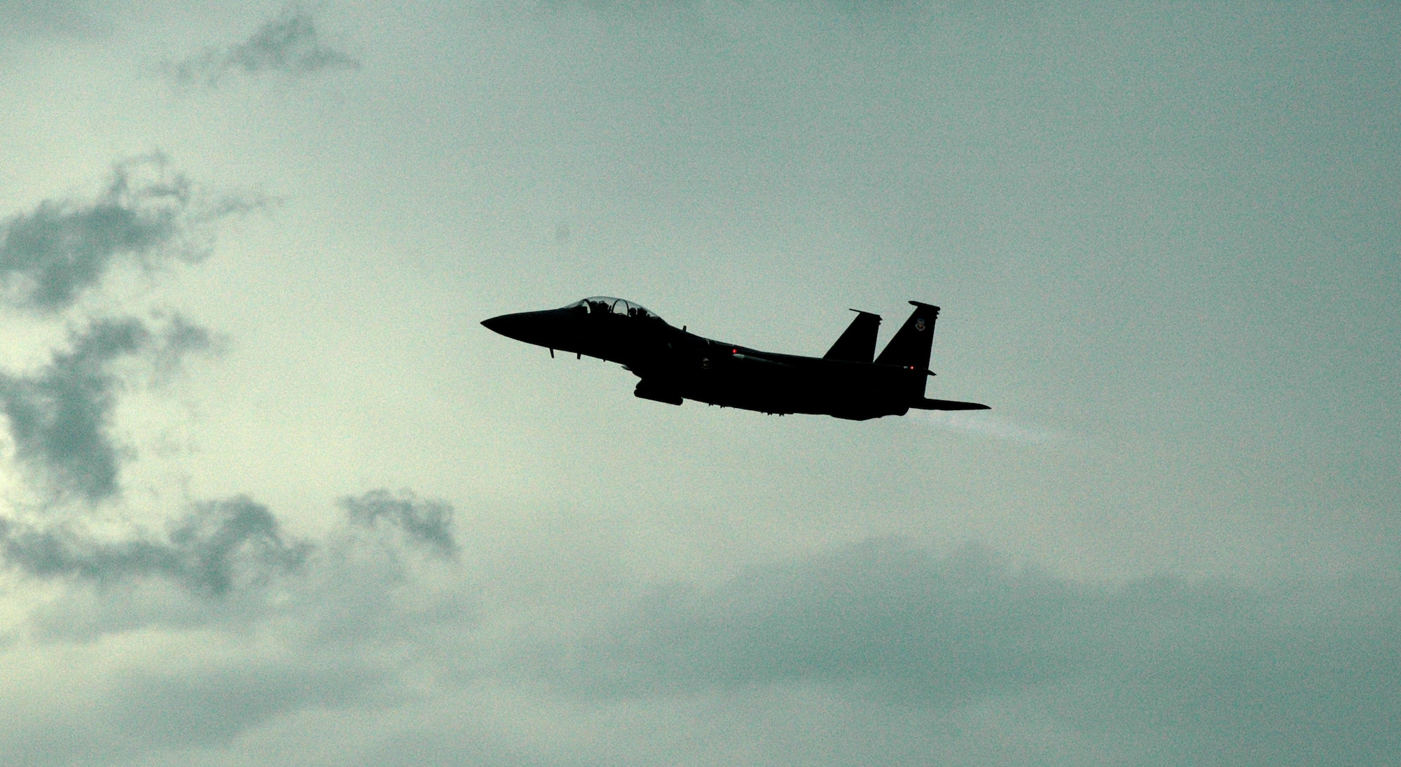 EGLIN AIR FORCE BASE, Fla. -- An F-15 takes off passing dark storm clouds to continue the Bold Quest Plus demonstration. A-10s, F-15s amd F-16s from the 422nd Test and Evaluation Squadron and 132 personnel were brought in by the 53rd Wing to help the internation Bold Quest players demonstrat and evaluate new equipment. (US Air Force photo/ Airman 1st Class Anthony Jennings)