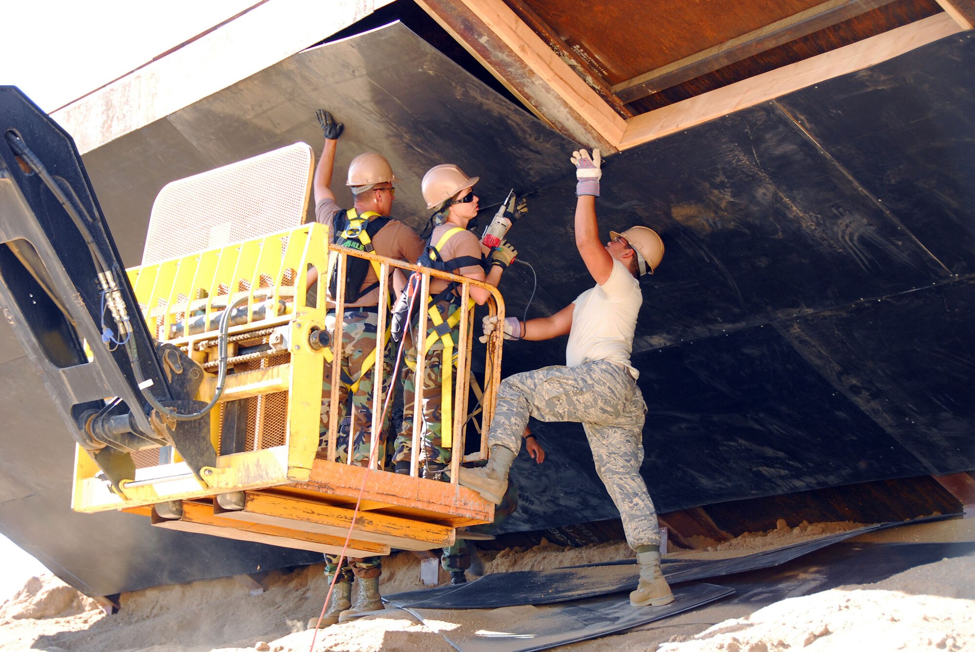A member of the 149th Fighter Wing Civil Engineer Squadron, Lackland Air Force Base, San Antonio, Texas, helps with the internal demolition of a building on Camp Morena, California. The unit worked on real-world engineering projects for the U.S. Navy and the Southwest Border Mission while simultaneously completing two weeks of training.