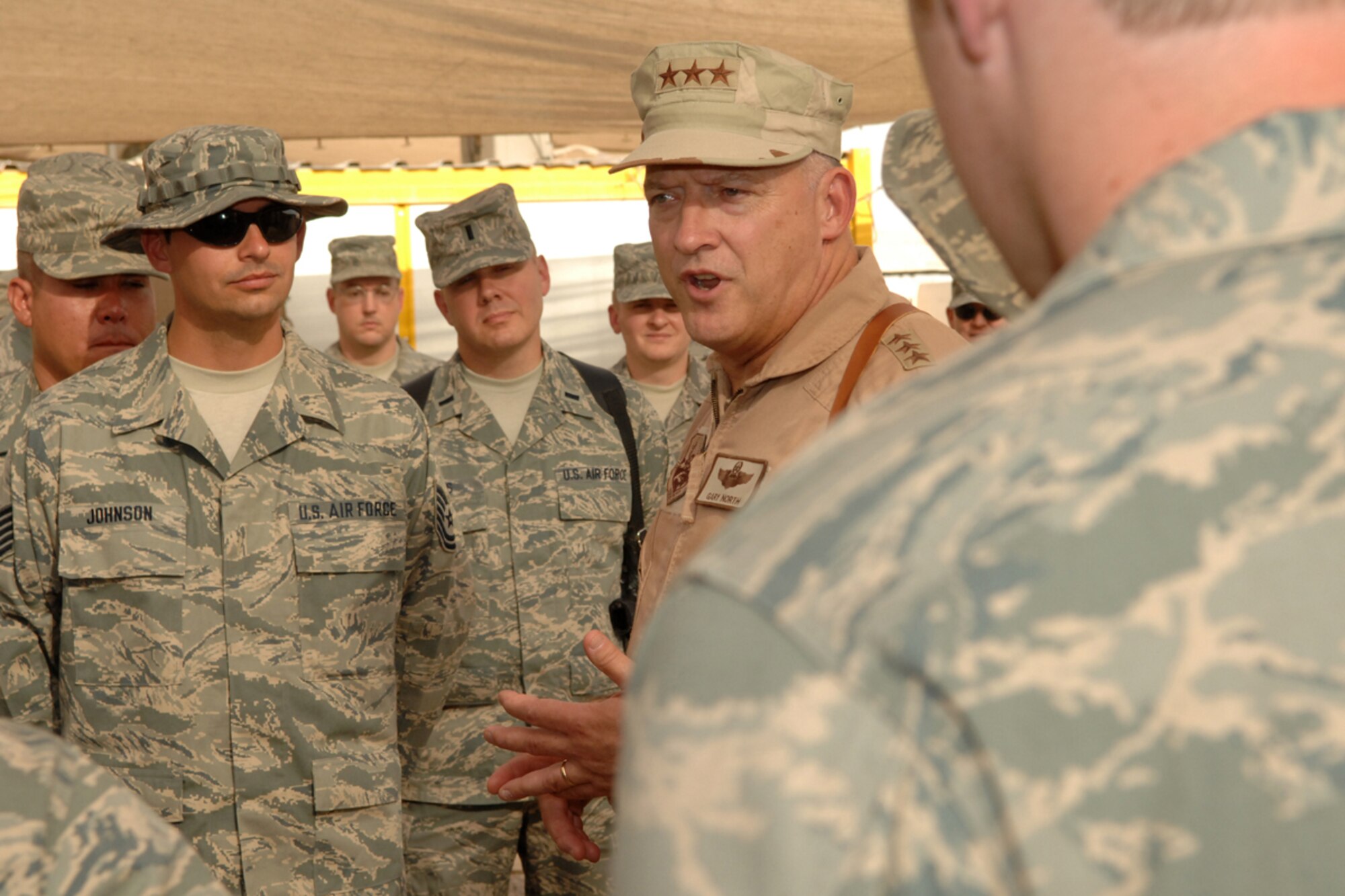 KIRKUK REGIONAL AIR BASE, Iraq -- Lt. Gen. Gary L. North, 9th Air Force and U.S. Air Forces Central commander, discusses issues with Airmen from the 506th Expeditionary Communications Squadron here July 29. Gen. North is visiting installations around the area of responsibility before returning to Shaw Air Force Base, S.C. (U.S. Air Force photo/Senior Airman Randi Flaugh)
