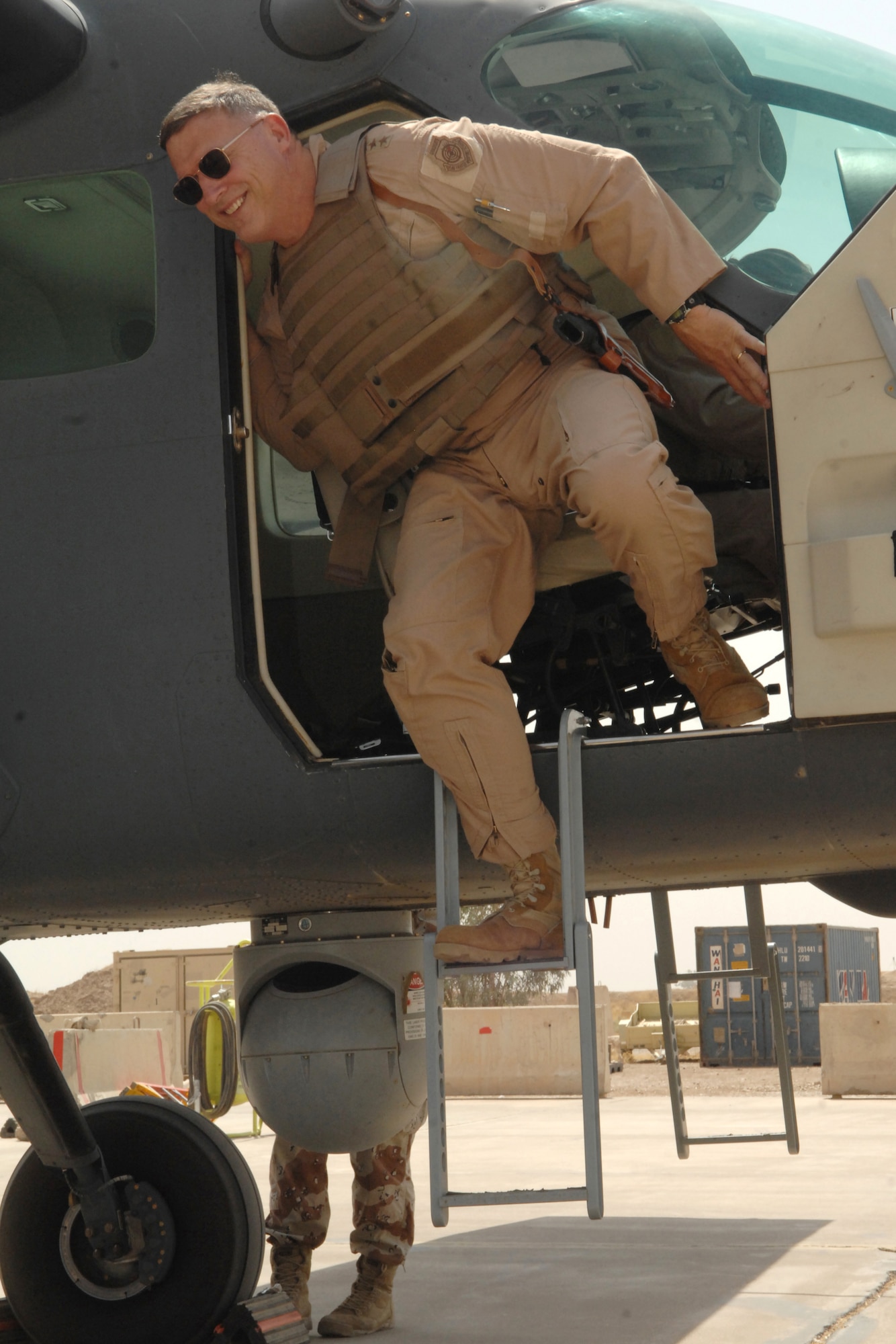 KIRKUK REGIONAL AIR BASE, Iraq -- Lt. Gen. Gary L. North, 9th Air Force and U.S. Air Forces Central commander, exits a Cessna C-208B "Caravan" after his flight here July 29.  Gen. North is visiting installations around the area of responsibility before returning to Shaw Air Force Base, S.C. (U.S. Air Force photo/Senior Airman Randi Flaugh)
