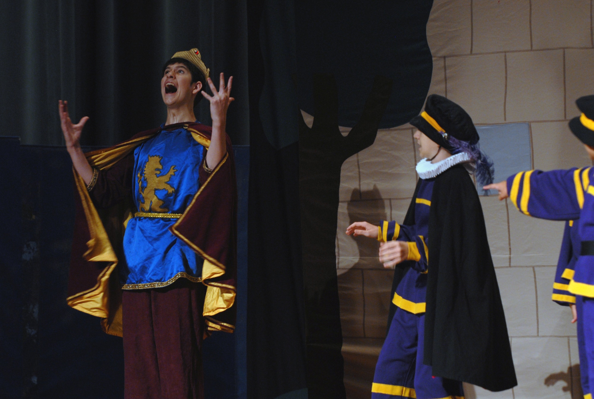 Steven Jones, playing the role of "Prince John" during dress rehearsal for
the Missoula Children's Theater presentation of "Robin Hood", yells at his
subordinates during the play.  The MCT gathered 60 youth from Kadena and
surrounding U.S. bases and prepared them in one week's time for the
performance. (U.S. Air Force photo/Staff Sgt. Christopher Marasky)
