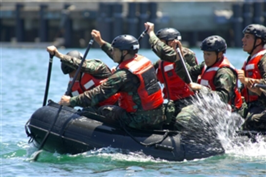 U.S. Navy sailors in special warfare combatant-craft training paddle a combat rubber raiding craft in San Diego Bay at Naval Amphibious Base Coronado, Calif., on July 23, 2008.  The special warfare combatant program creates sailors capable of operating and maintaining the Navy's inventory of high-performance boats used to support SEALs in special operations missions worldwide.  