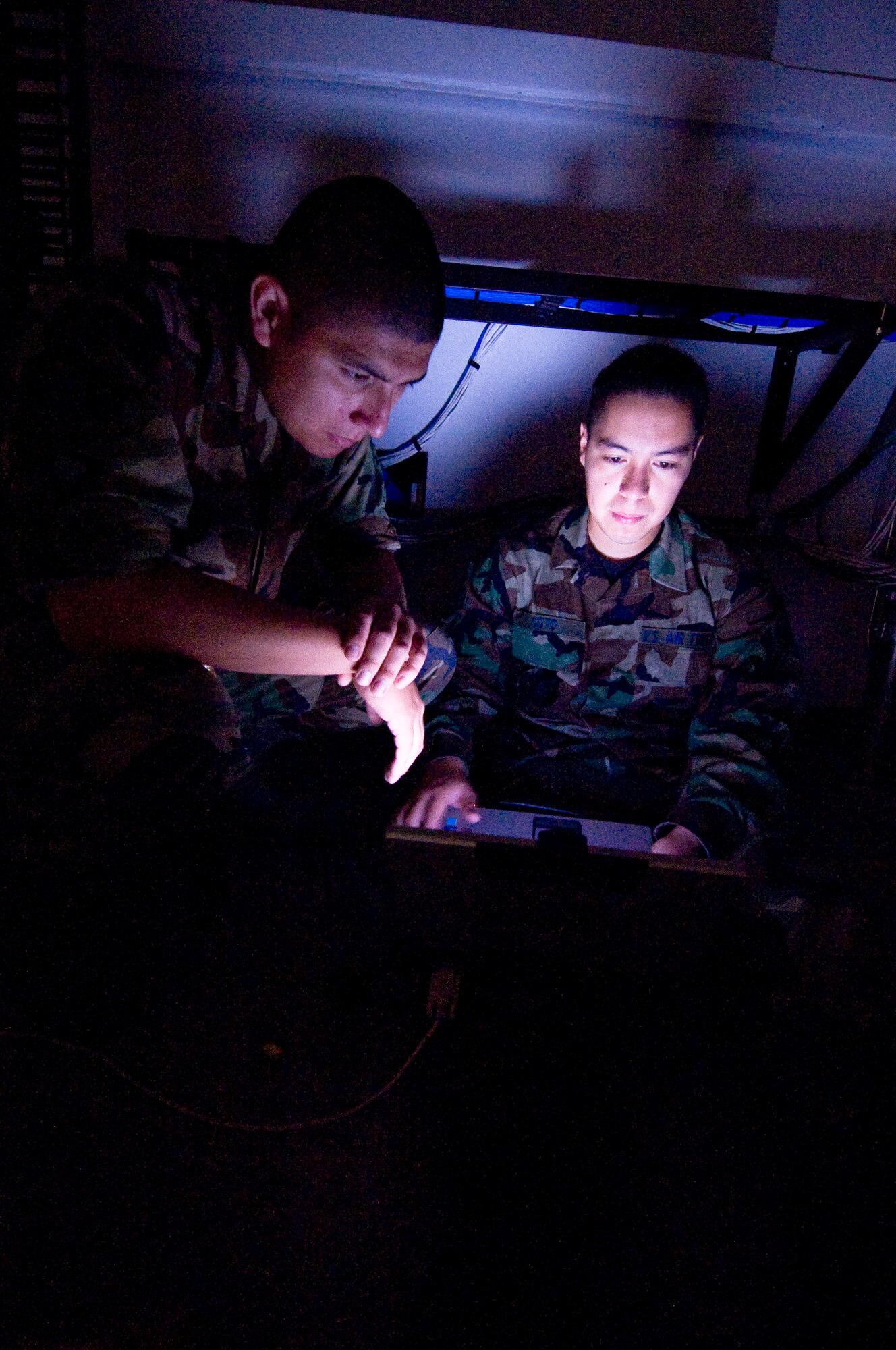 Senior Airman Ricardo Soto, right, and Senior Airman Dominic Garcia, left, use a laptop to configure the foundry switch in the new fitness center addition July 31, 2008, at Eielson Air Force Base, Alaska. Once installed, the switch will provide local area network connectivity for the Health And Wellness Center computers which will enable them access to internet, e-mail and base networks. Both Airmen are network infrastructure technicians assigned to the 354th Communication Squadron. (U.S. Air Force photo by Airman 1st Class Jonathan Snyder) (Released)