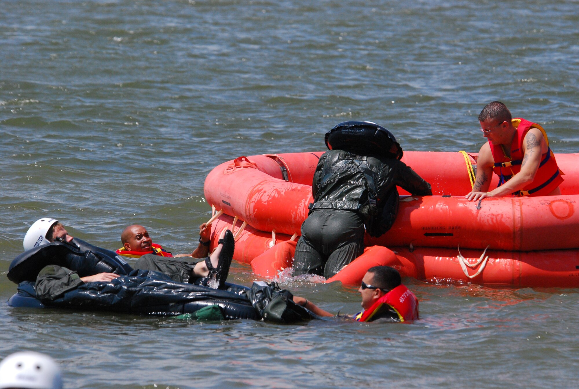 Pilots from the 457th Fighter Squadron recently endured their annual water survival training conducted on Lake Worth in Fort Worth, Texas. Members of the 457th Life Support assist the pilots in the correct procedures of individual and rubber duck entry. (U.S. Air Force Photo/Tech. Sgt. Julie Briden-Garcia)