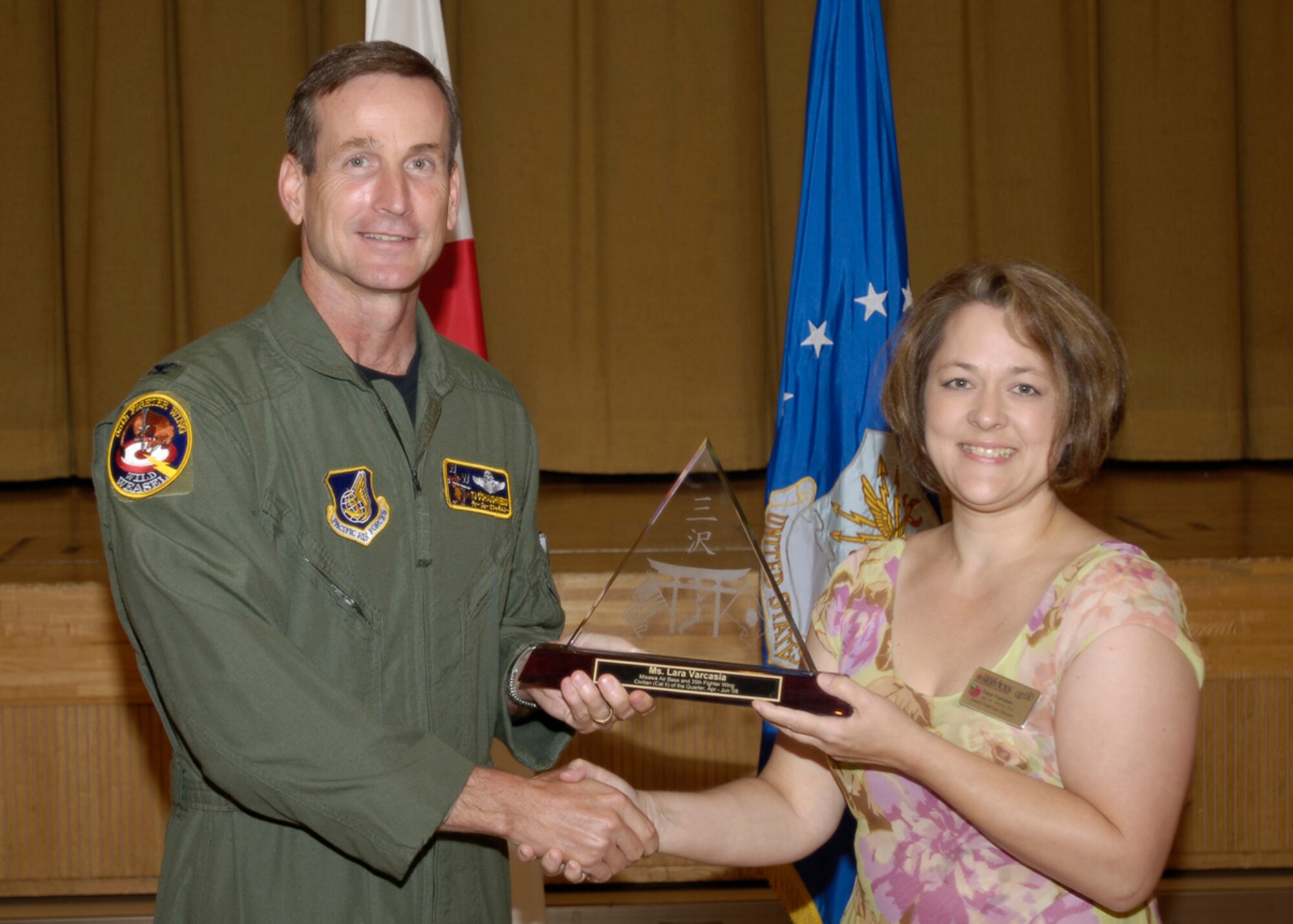 MISAWA AIR BASE, Japan -- Ms. Lara Varcasia, 35th Force Support Squadron, receives 35th Fighter Wing Civilian of the Quarter Category 2 during the wing quarterly award luncheon July 17, 2008.  Ms. Varcasia is a native of San Antonio, Texas and has worked at Misawa for two years.  (U.S. Air Force photo by Senior Airman Chad Strohmeyer)
