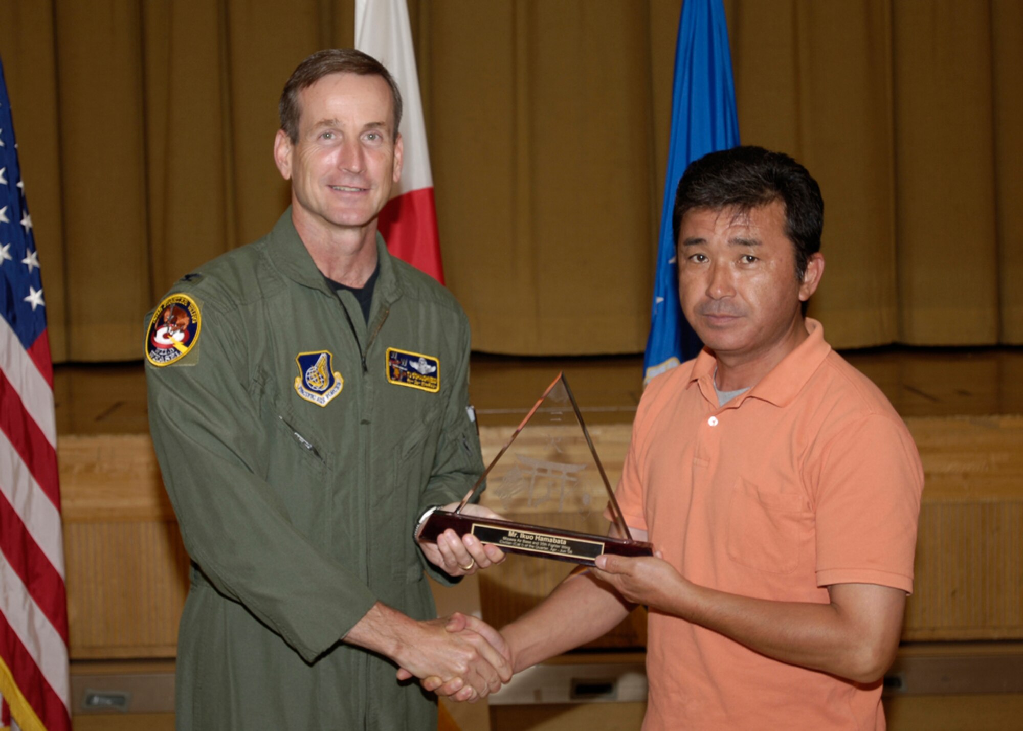 MISAWA AIR BASE, Japan -- Mr. Ikuo Hamabata, 35th Communications Squadron, receives 35th Fighter Wing Civilian of the Quarter Category 1 during the wing quarterly award luncheon July 25, 2008.  Mr. Hamabata is a native of Hirono Town, Iwate Prefecture, Japan, and has worked at Misawa for 30 years.  (U.S. Air Force photo by Senior Airman Chad Strohmeyer)