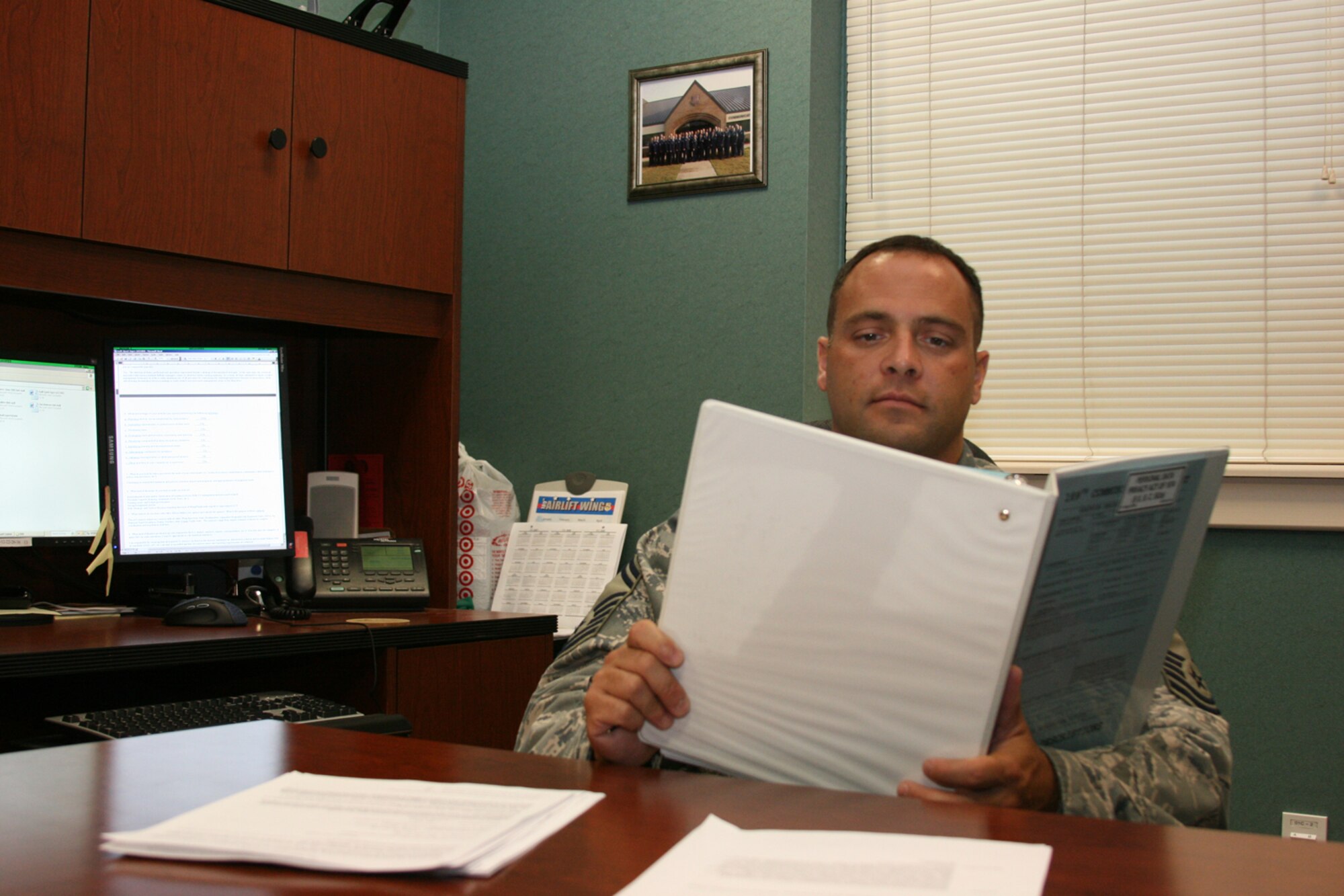 Senior Master Sgt. Joe Lucchesi, 189th Communications Flight superintendent, oversees a flight of more than 30 enlisted members. The flight provides computer, phone and maintenance support to the 830-member 189th Airlift Wing. (Photo by Master Sgt. Bob Oldham)