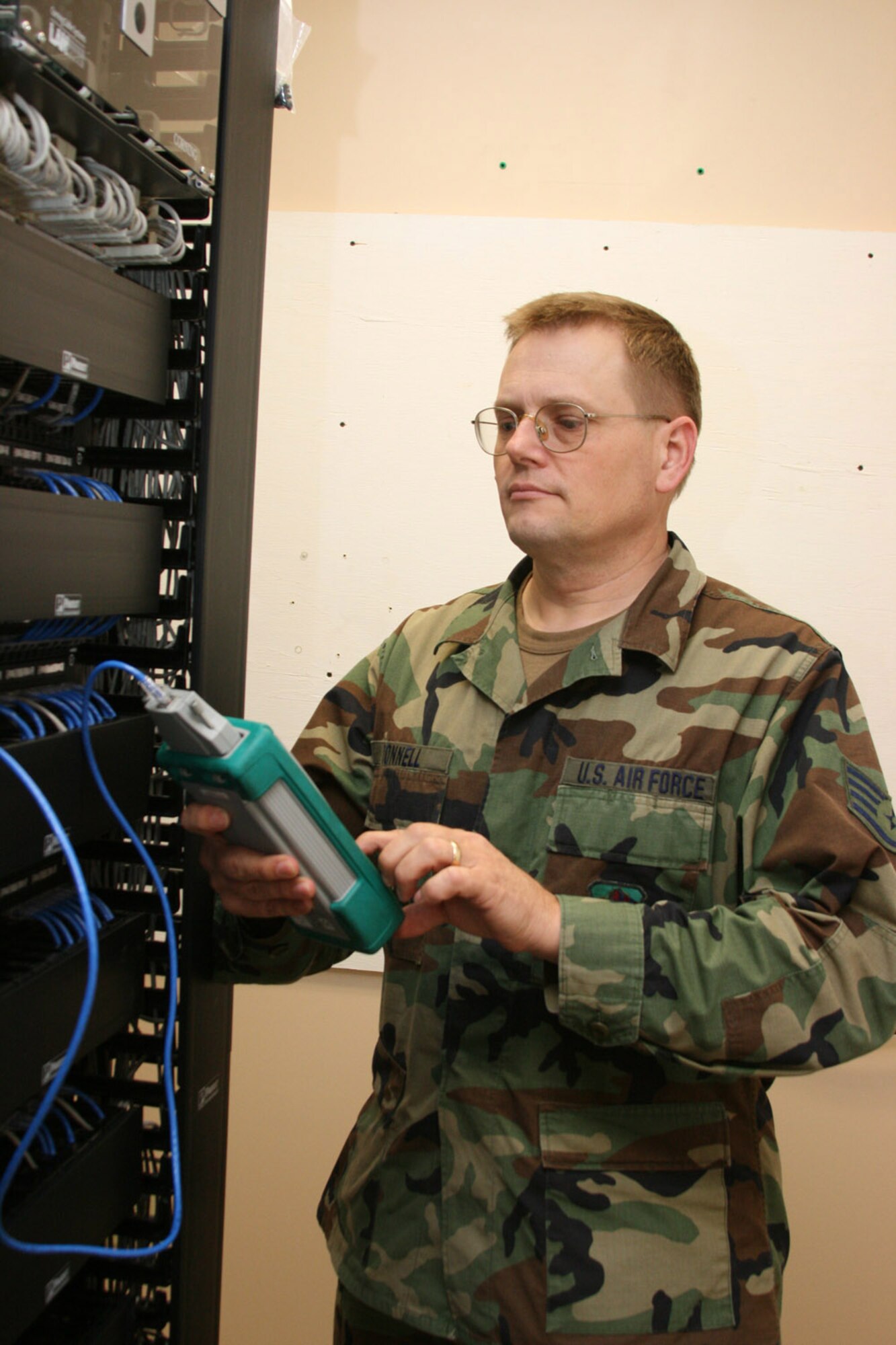 Staff Sgt. Kalvin Donnell, a 189th Communications Flight a voice network systems craftsman, troubleshoots a local-area network patch.
