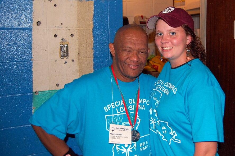 Senior Airman Brenda Skaggs, a reservist with the 307th Red Horse Squadron currently working with the 2d Fitness Support Squadron, takes a quick break from the competition with Special Olympic athlete Albert Jackosn during the Special Olympics Louisiana state unified bowling competition held at the Holiday Inns bowling alley in Bossier City. On July 26 more than 75 Airmen turned out for the event which also consisted of a state swim competition held at Louisiana State University in Shreveport. (U.S. Air Force photo)