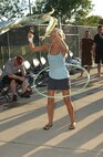 7/29/2008 - Airman 1st Class Michelle Garrison, 59th Medical Logistics and Readiness Squadron, shows off her hula-hoop skills at the Warhawk pool during the Check Six event July 29. (USAF photo by Alan Boedeker)