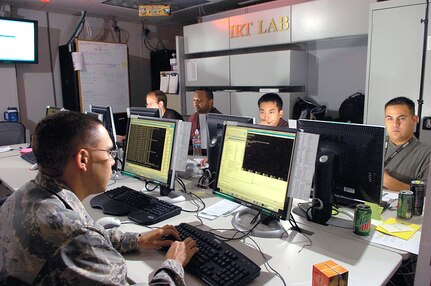 First Lt. Orlando Garcia responds to potential threats in the Incident Response Team Net Forensics Lab. Members of the team have two minutes to evaluate incoming threats. (USAF photo)