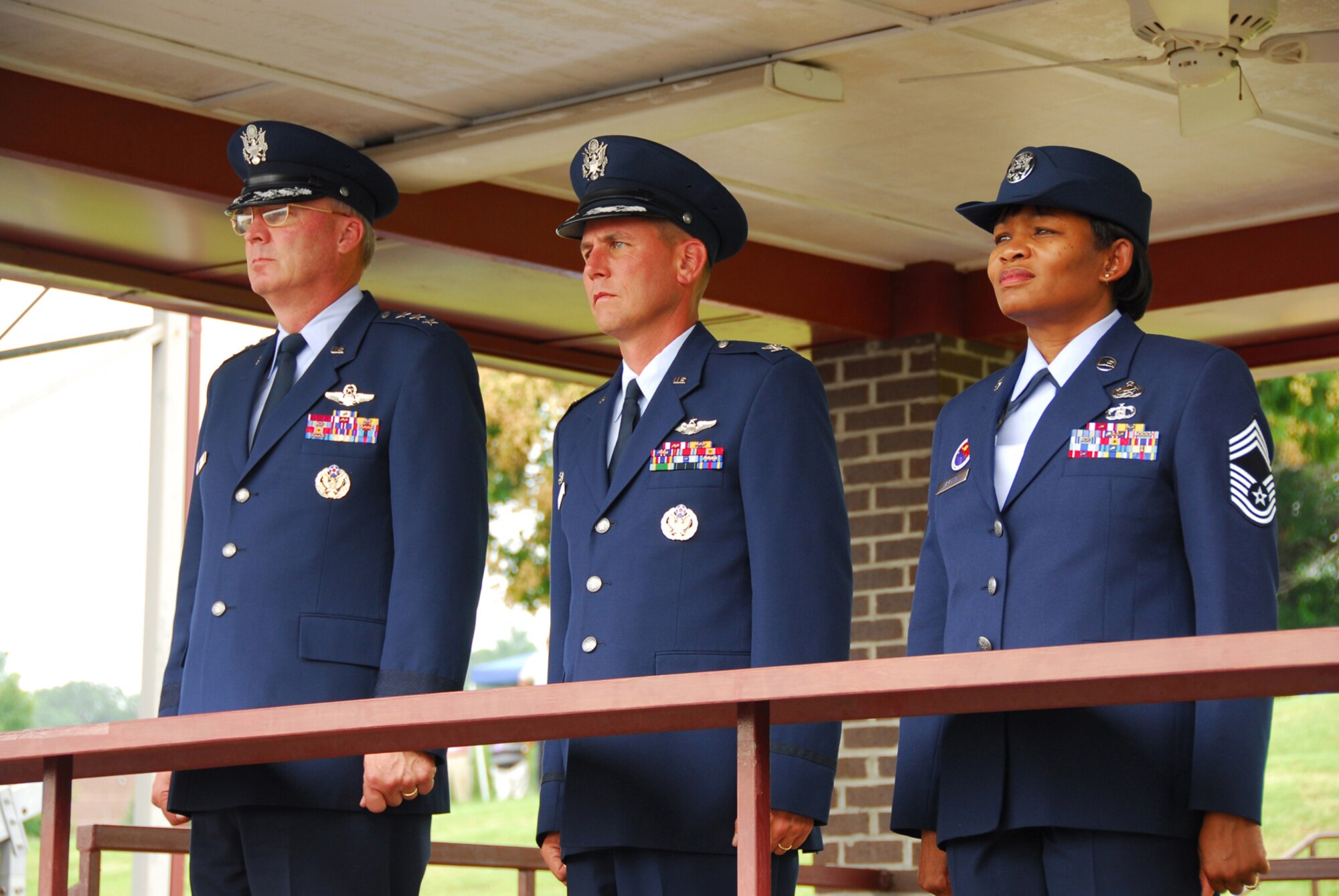 From left, Lt. Gen. Craig R. McKinley, director of the Air National Guard, Col. Michael L. Waggett, commander of the Air Guard's I.G. Brown Training and Education Center (TEC) and Chief Master Sgt. Deborah Davidson, TEC enlisted education commandant, watch a pass and review of Noncommissioned Officer Academy students July 31 during the TEC's 40th anniversary celebration at McGhee Tyson Air National Guard Base, Tenn. (Photo by Air Force Tech. Sgt. Kendra Owenby, Tennessee National Guard)