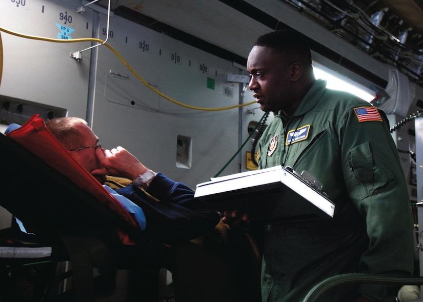 A medical physician talks to a patient returning on a medical evacuation flight on a C-17 Globemaster III at Andrews Air Force Base, Md., Sept. 25, 2007. The patients are transported to various medical treatment facilities in the National Capital Region. 