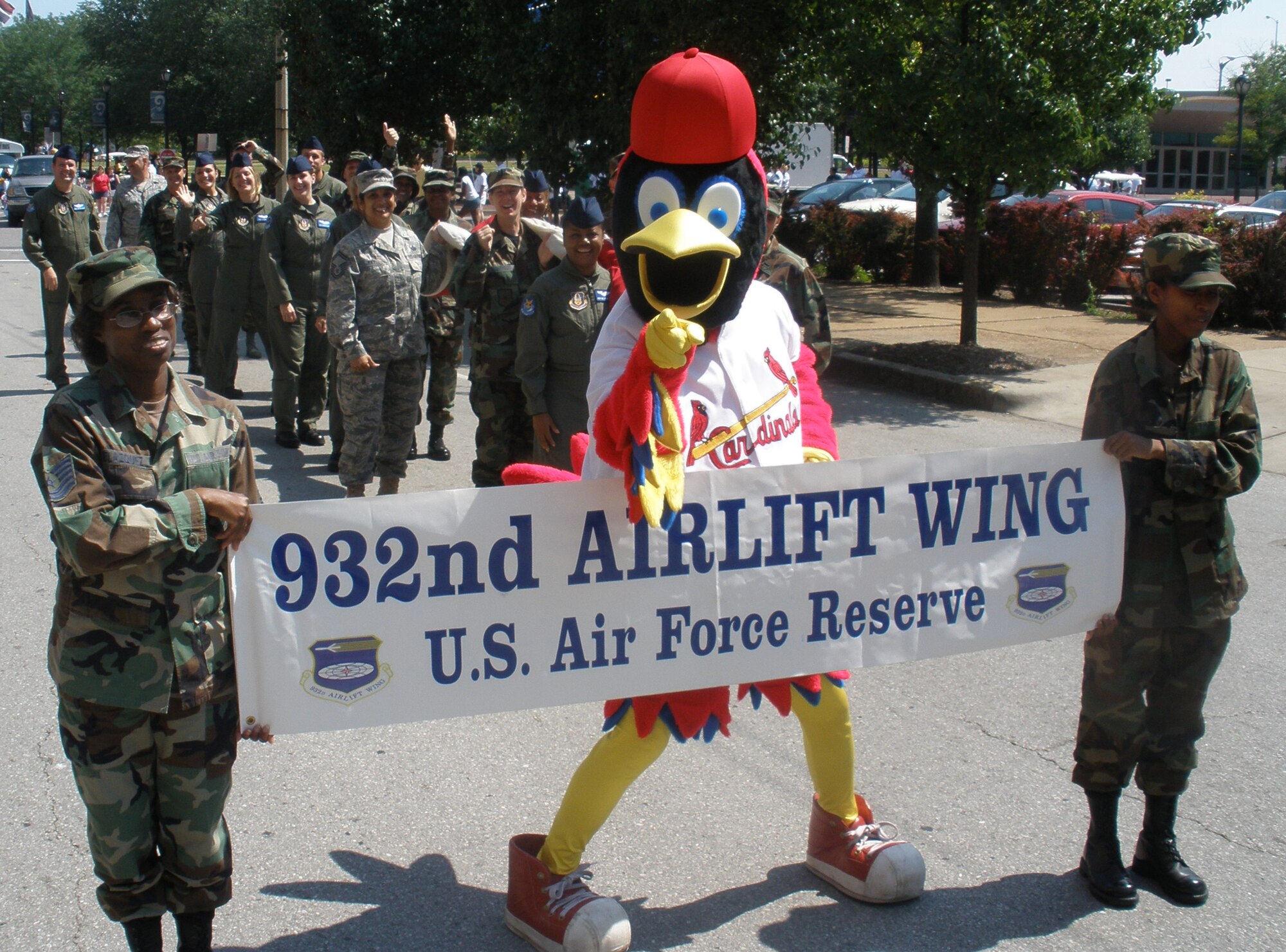 The Saint Louis Cardinal's mascot Fredbird joined up with the proud members of the 932nd Airlift Wing to say thanks to the community in downtown recently.  The Air Force Reserve Command wing known as the "Gateway Wing" is located 30 minutes east from the arch landmark.  Reservists participate in several parades throughout the year to stay involved with the public.  The next parade will be Veteran's Day and we hope to see you there!  Photo/Maj. Stan Paregien
