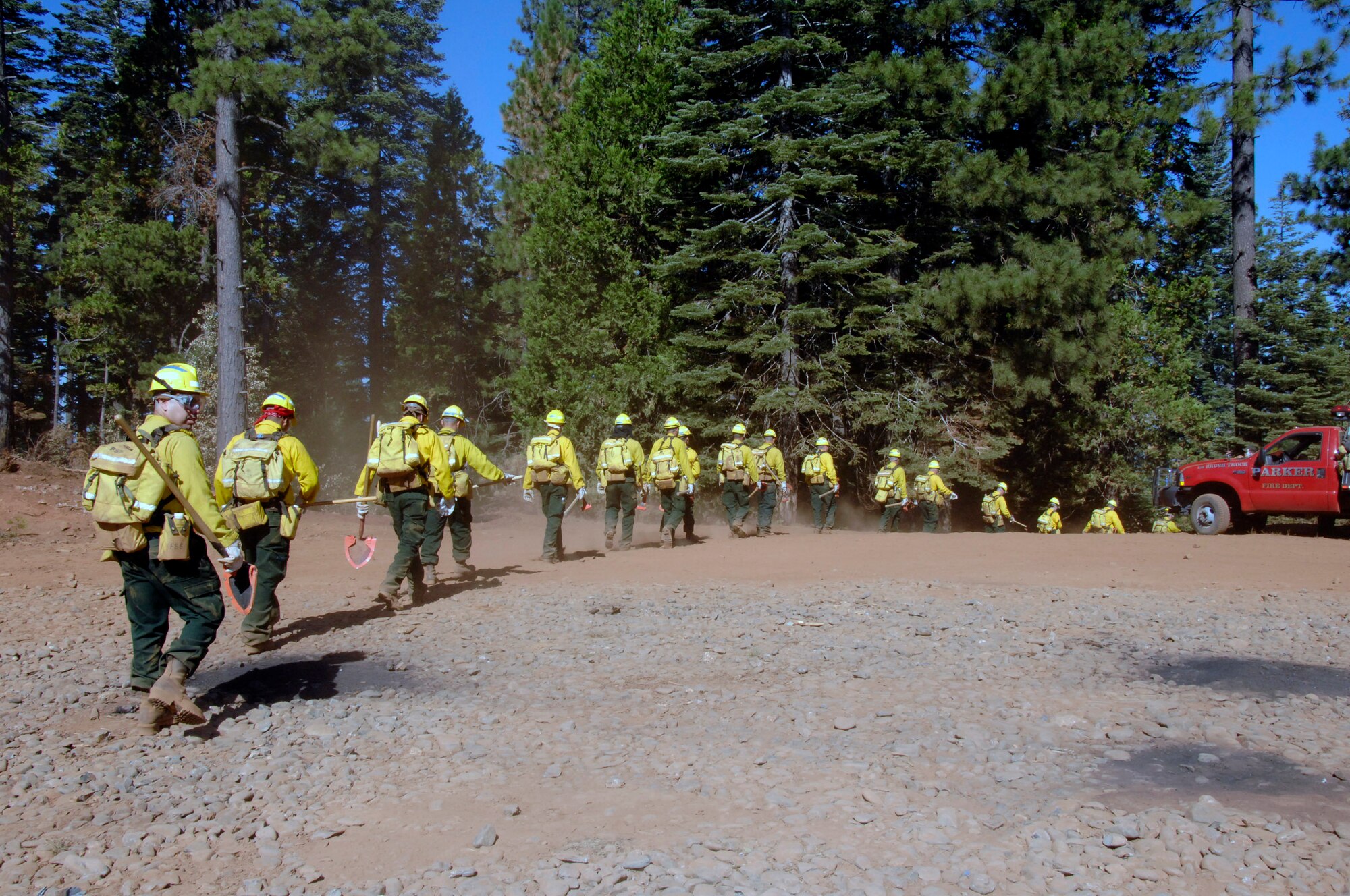 Members from the California Air National Guard's 129th Rescue Wing, 144th Fighter Wing, 146th Airlift Wing, 163rd Reconnaissance Wing and 162nd Combat Communications Group head out to the forest outside of Paradise City, Calif., July 27 to conduct fireline training during Operation Lightning Strike.  California Air National Guard officials activated more than 200 members from the various Wings in California to help fight the wildland fires in Northern California. (U.S. Air Force photo/Master Sgt. Dan Kacir)