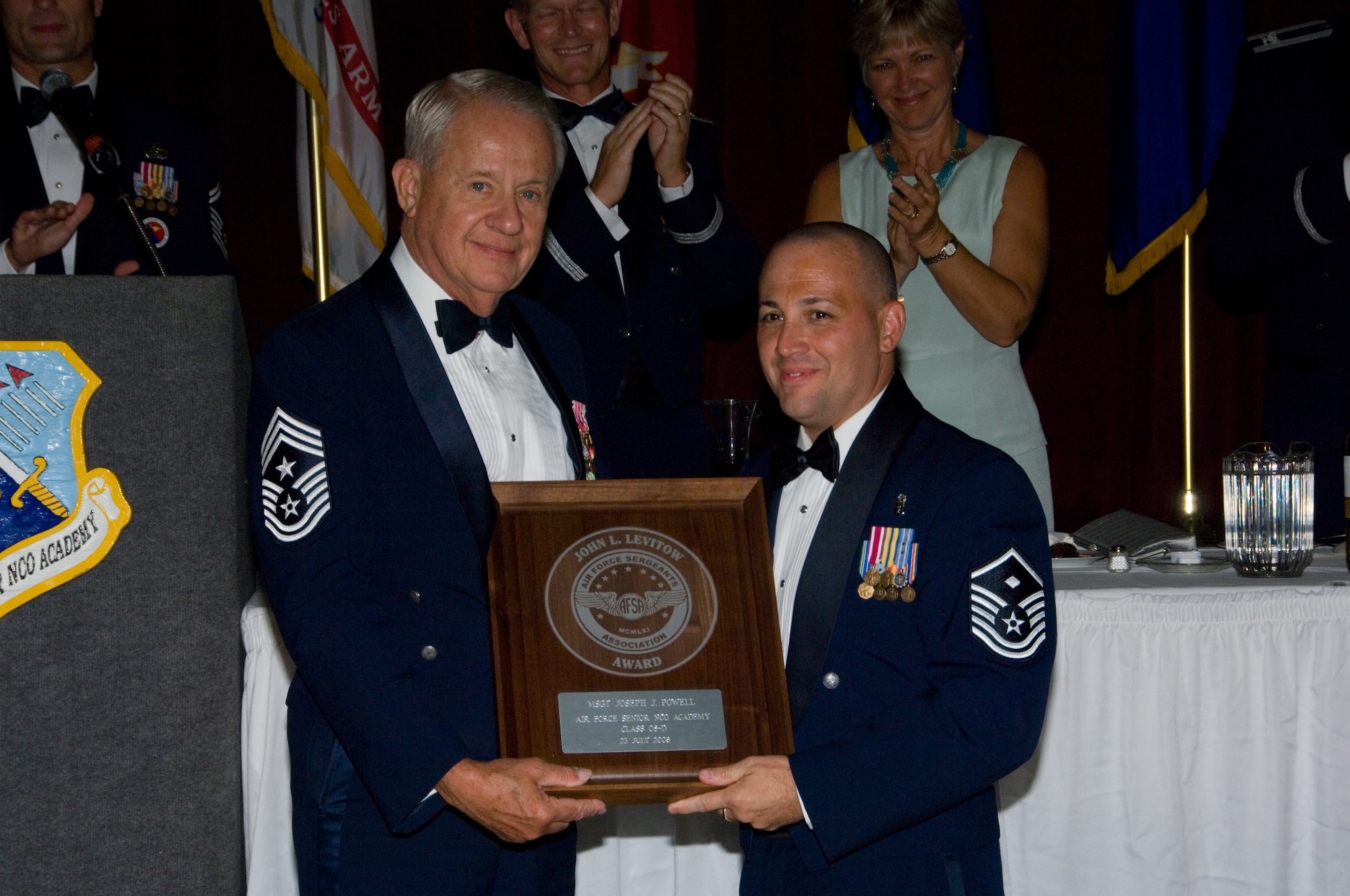 Master Sgt. Joseph Powell receives the Levitow Award July 23 from Chief Master Sgt. (ret.) John McCauslin at the Senior NCO Academy in Alabama (U.S. Air Force photo by Melanie Rodgers)