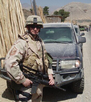 NIAGARA FALLS AIR RESERVE STATION, N.Y. -- Master Sgt. Jeff Gray, 2008 Air Force First Sergeant of the Year, poses in front of an Afghanistan mountain range during his most recent deployment to Southwest Asia.       