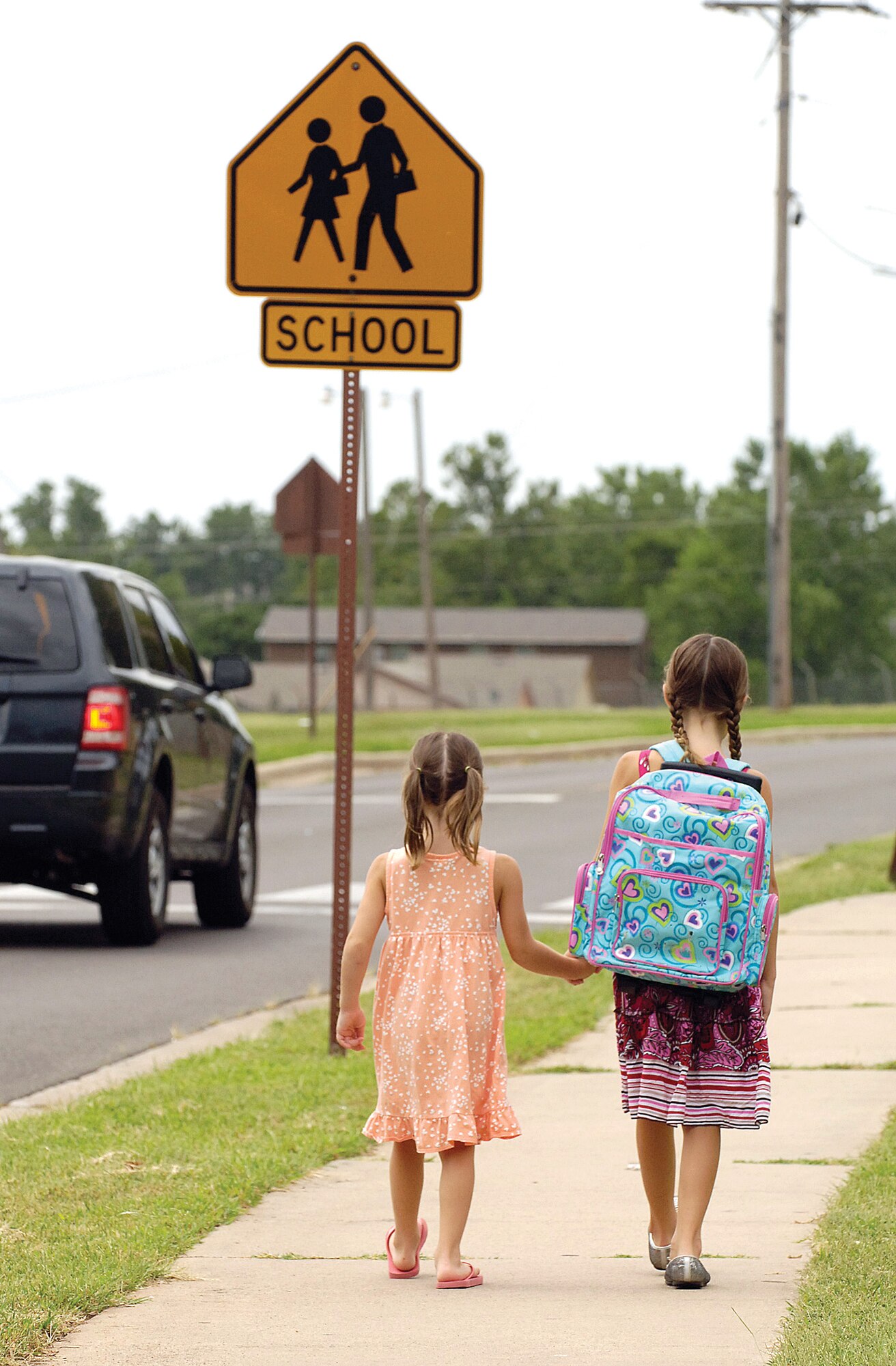School is back in session at Tinker Elementary August 12. The crosswalks will soon fill with children making morning treks to education and afternoon marches to freedom. The school is on Mitchell Road, which runs right through the housing area and is a major thoroughfare for servicemembers going to and returning from work. The speed limit in base housing is 15 miles per hour. This never changes, whether or not school is in session. Drivers are urged to take caution, observe the signs around these areas, obey the posted speed limit and remember that children don’t always pay attention when they are crossing the street. Vehicles traveling in both directions are required to stop when a pedestrian is using the crosswalk, in base housing or anywhere else on base.(Air Force photo/Margo Wright)