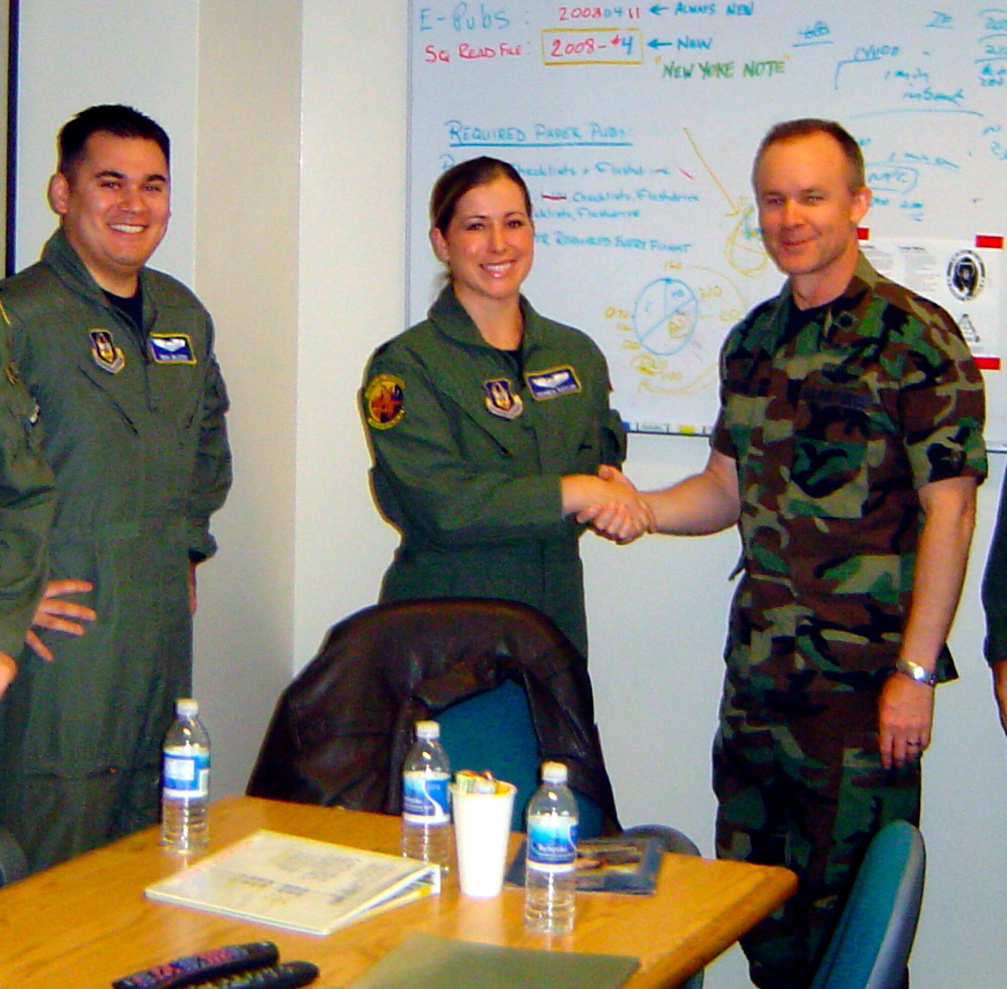 TRAVIS AIR FORCE BASE, Calif. -- The 79th Air Refueling Squadron commander, Lt. Col. John B. Williams, recently welcomed Lt. Neal Blasco and Capt. Amanda Naylor, as the newest pilots hired to the unit. Aircrew members from Beale Air Force Base, Calif., were invited to interview for positions at a board held in the 79th ARS here at Travis in July. 
Beale AFB was affected by the outcome of the most recent Base re-alignment and closure Commission in 2005. One of the results of the Commission’s work was to change the mission of the 940th Air Refueling Wing. In this change the wing lost its KC-135 Stratotankers and replaced them with RQ-4 Global Hawks.  Now after a long and distinguished history of manned flight, the squadron is to change to operating unmanned aerial vehicles in a reconnaissance role.  
This change and others at Beale was quite a blow to many members of the 940 ARW. Some were able to cross train to new jobs at the base, while others retired. Many began to look for positions across the Command.  Travis AFB, located nearby with its extensive Air Force Reserve Command flight operations, was an obvious place for members so displaced to consider. (U.S. Air Force courtesy photo)