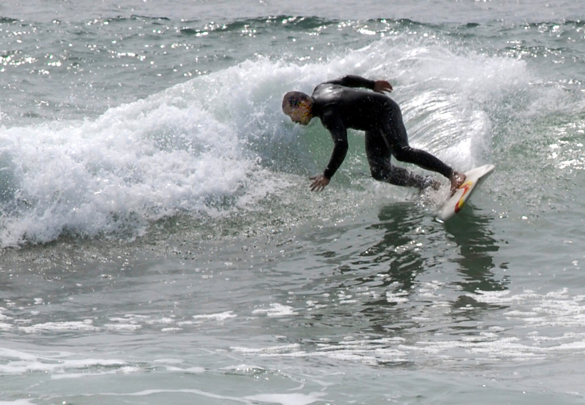 VANDENBERG AIR FORCE BASE, Calif. --  A surfer braves the frigid waters off one of Vandenberg's beaches Friday.  The Central Coast is said by many to have some of the best surfing locations in California. (U.S. Air Force photo/Staff Sgt. Raymond Hoy)