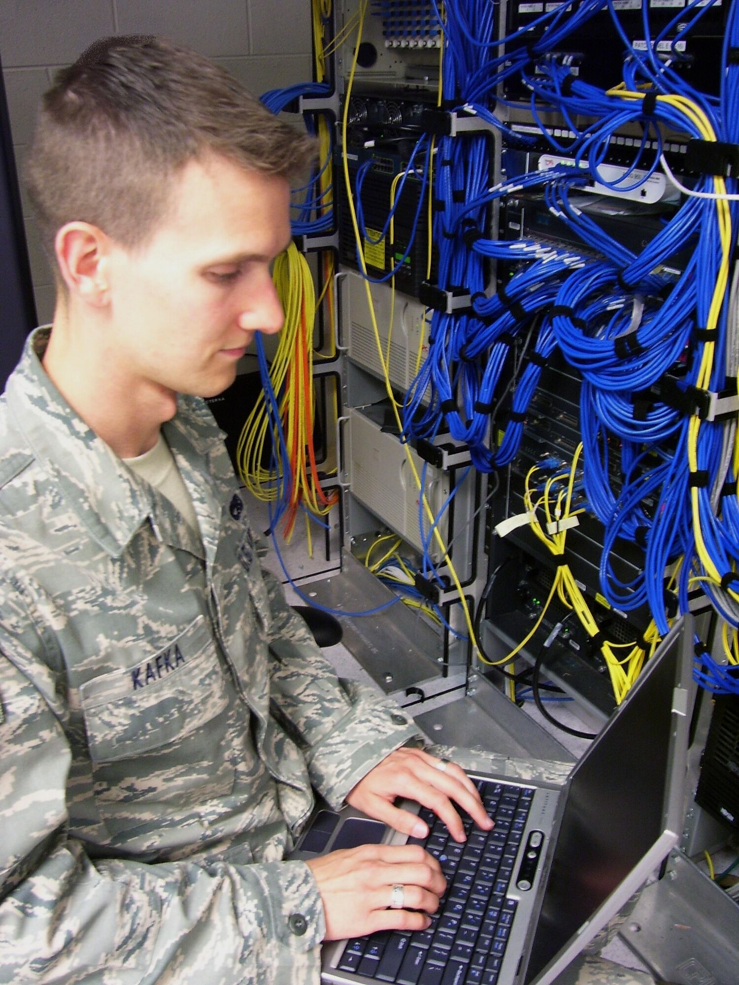 BUCKLEY AIR FORCE BASE, Colo. -- Airman 1st Class Robert Kafka, 460th Space Communications Squadron, configures a router. Airman Kafka is the Warrior of the Week for July 25 - 31. (Courtesy photo)