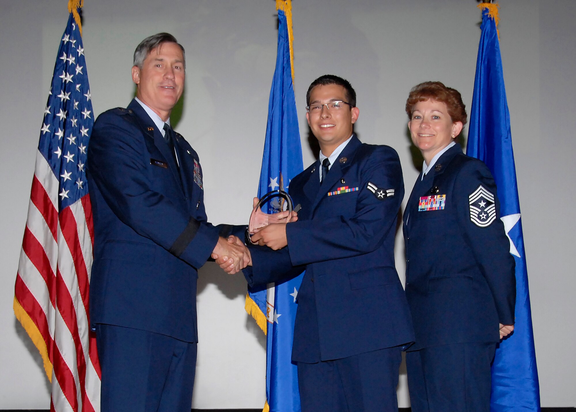 Brig. Gen. O. G. Mannon, 82nd Training Wing commander, presents Airman 1st Class Jordan Herrera, 82nd Medical Group, with the Airman of the Quarter award July 30. (U.S. Air Force photo/Mike Litteken) 