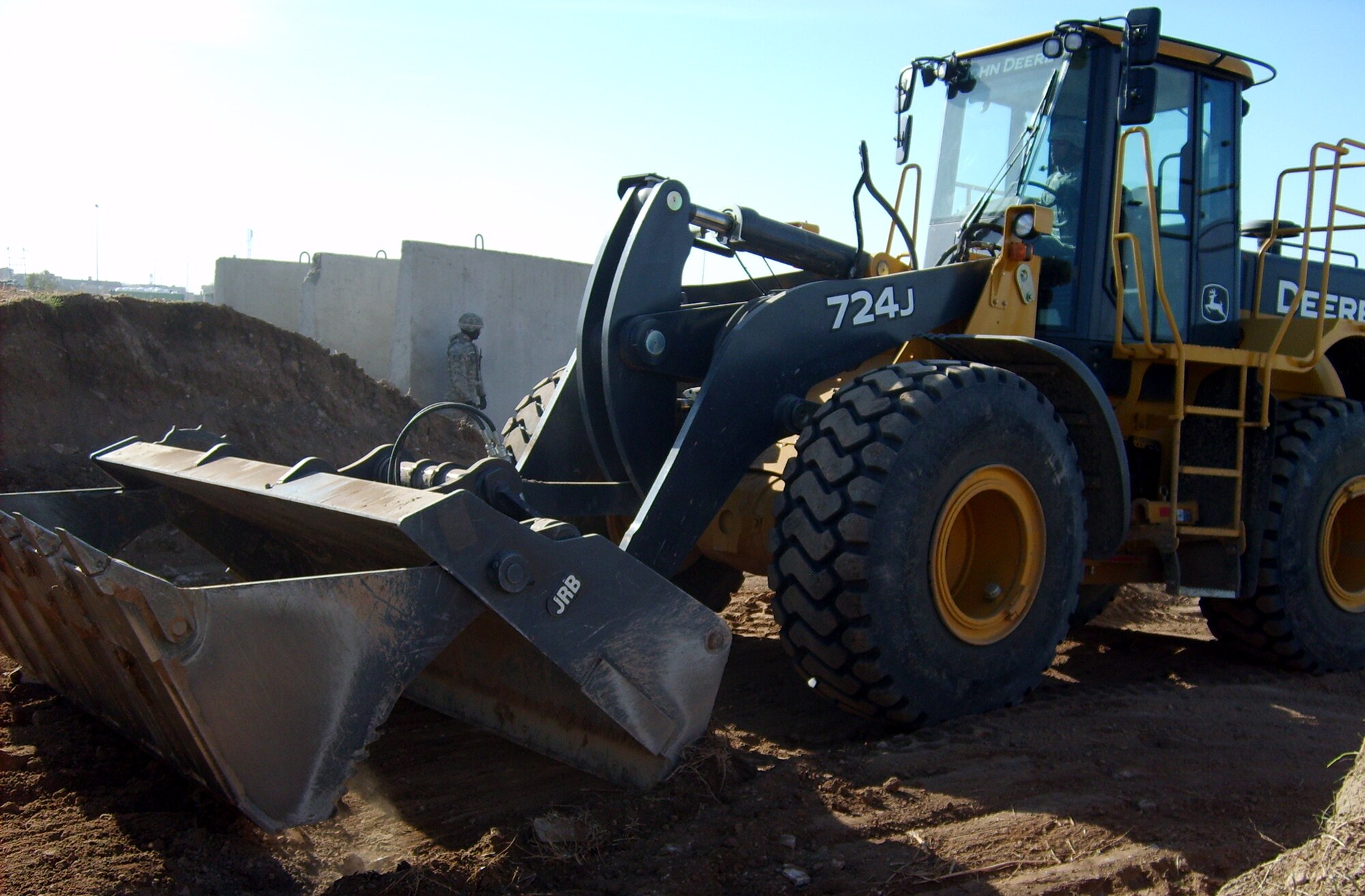 Heavy equipment operators from the 442nd Civil Engineer Squadron clear debris from a Kirkuk Air Base, Iraq, work-site during the squadron's deployment there in 2008. (Courtesy Photo)