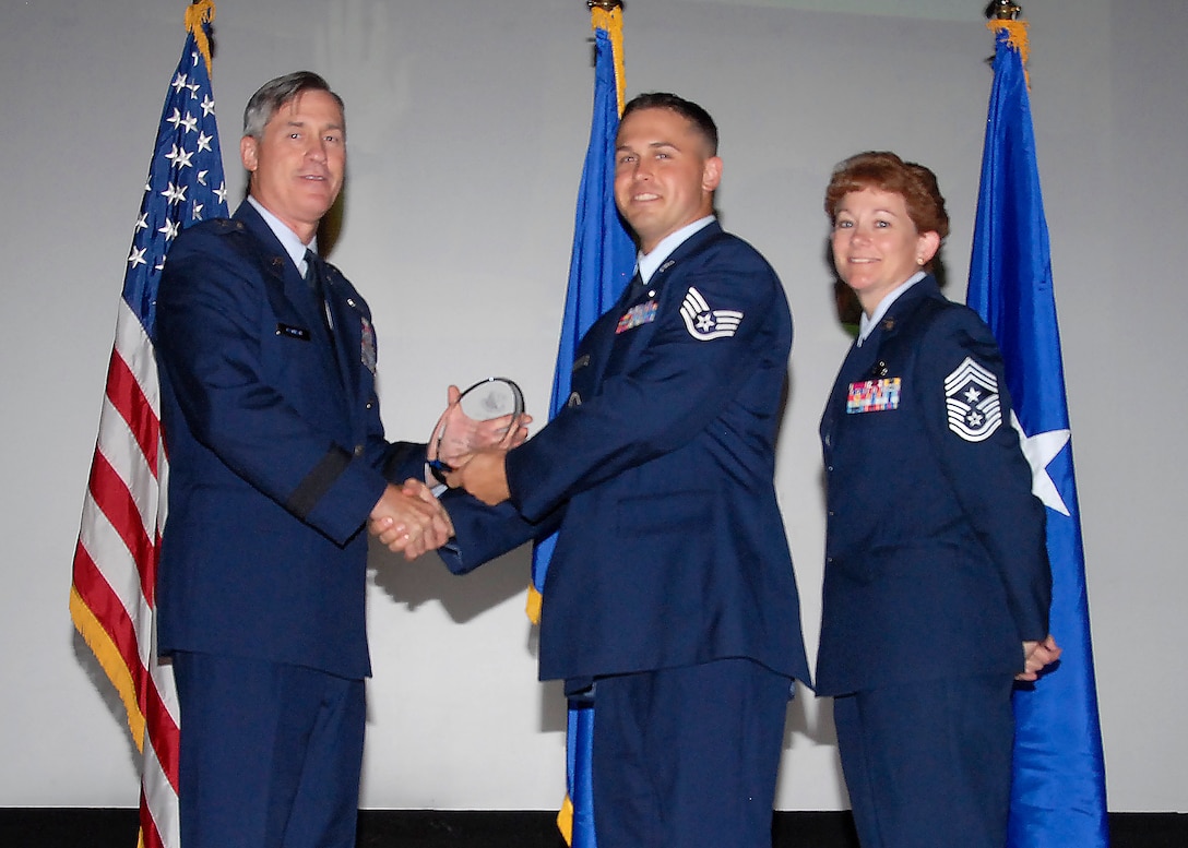 Brig. Gen. O.G. Mannon, 82nd Training Wing commander, presents Staff Sgt. Eric Sinclair, 782nd Training Group, with the Noncommissioned Officer of the Quarter award, July 30. (U.S. Air Force photo/Mike Litteken) 
 

