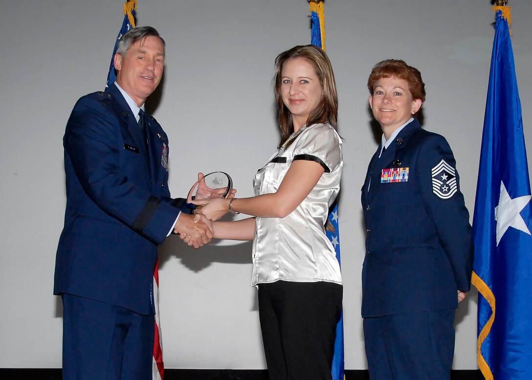 Brig. Gen. O.G. Mannon, 82nd Training Wing commander, presents Amy Cerruti, 782nd Training Group, with the Civilian of the Quarter award, category I, July 30. (U.S. Air Force photo/Mike Litteken) 
 
