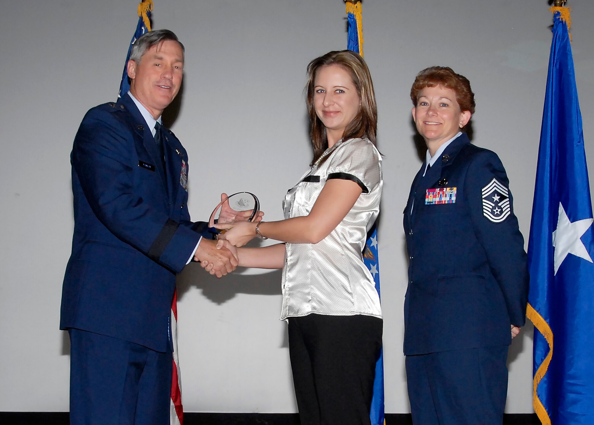 Brig. Gen. O.G. Mannon, 82nd Training Wing commander, presents Amy Cerruti, 782nd Training Group, with the Civilian of the Quarter award, category I, July 30. (U.S. Air Force photo/Mike Litteken) 
 
