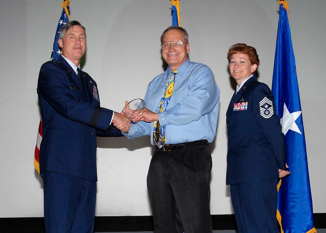 Brig. Gen. O.G. Mannon, 82nd Training Wing commander, presents Mark Snyder, 82nd Mission Support Group, with the Civilian Supervisory of the Quarter award, category II,  July 30. (U.S. Air Force photo/Mike Litteken) 
 
