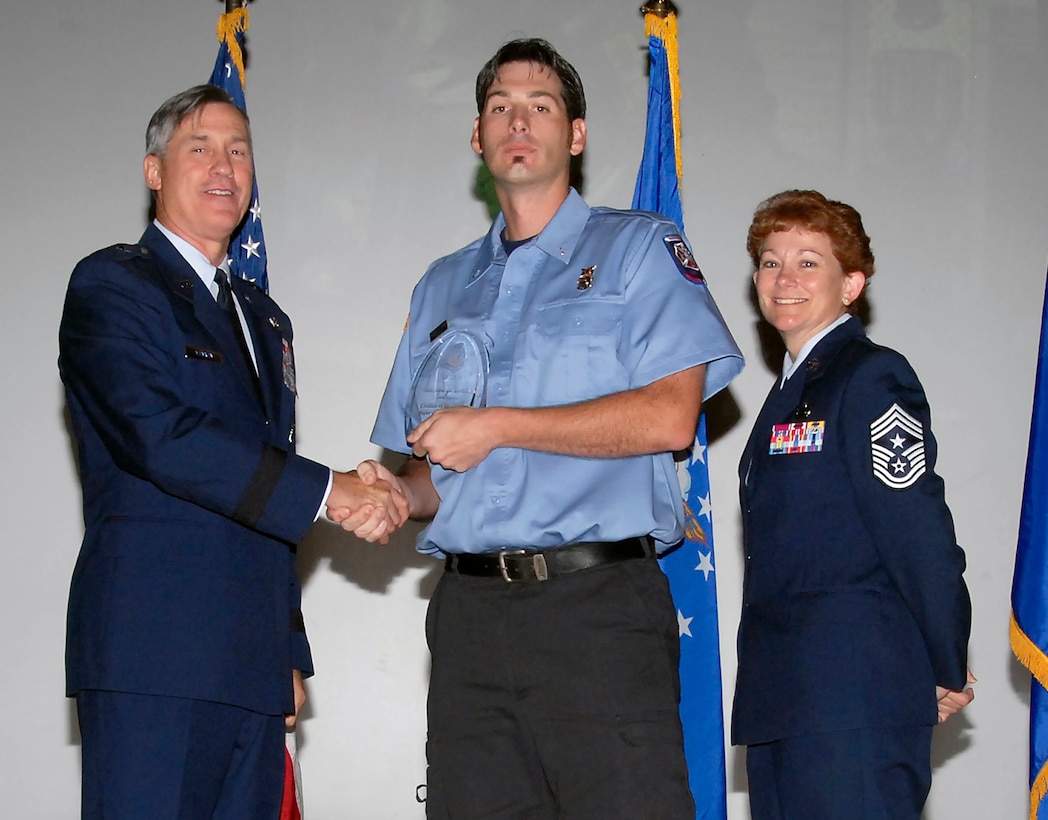Brig. Gen. O.G. Mannon, 82nd Training Wing commander, presents Joshua Leming, 82nd Mission Support Group, with the Civilian Supervisory, category I of the Quarter award July 30. (U.S. Air Force photo/Mike Litteken) 
 
