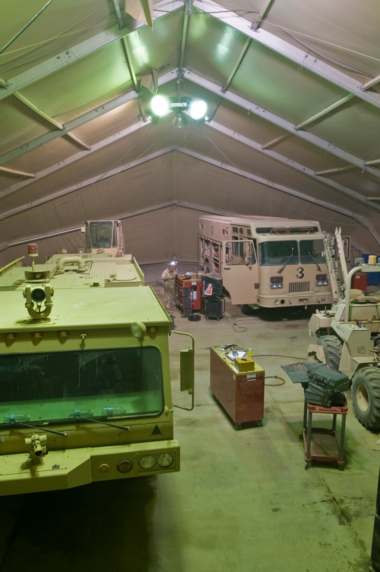 ALI BASE, Iraq -- Airmen of the 407th Expeditionary Logistics Readiness Squadron Vehicle Maintenance Shop here maintain all Air Force vehicle assets, more than 300 vehicles and other heavy machinery. Vehicles have electrical components switched out and the oil is changed more frequently, because of the severe heat conditions and extremely sandy conditions here in Iraq. (U.S. Air Force photo/Airman 1st Class Christopher Griffin)
